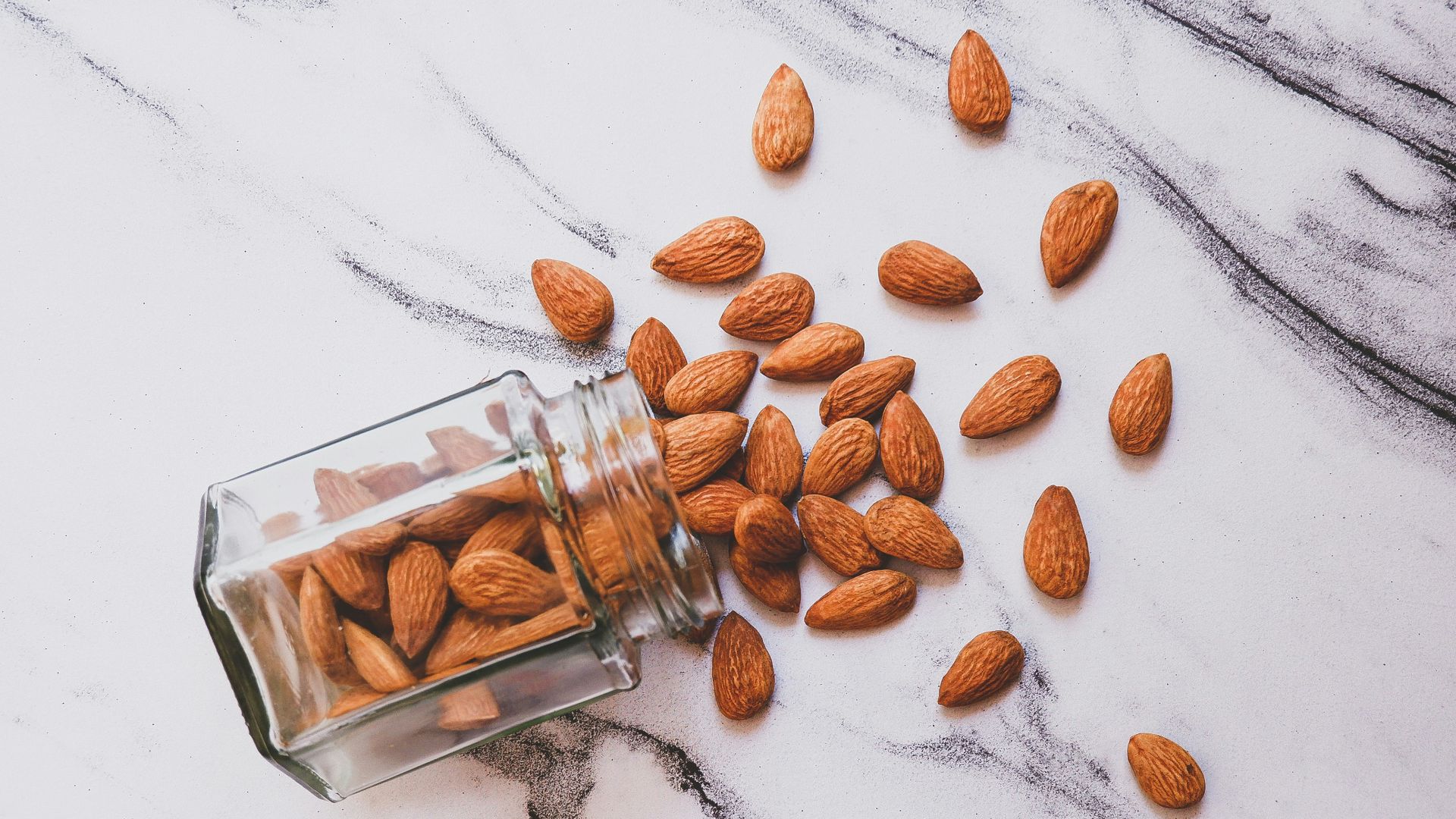 brown almond on white table