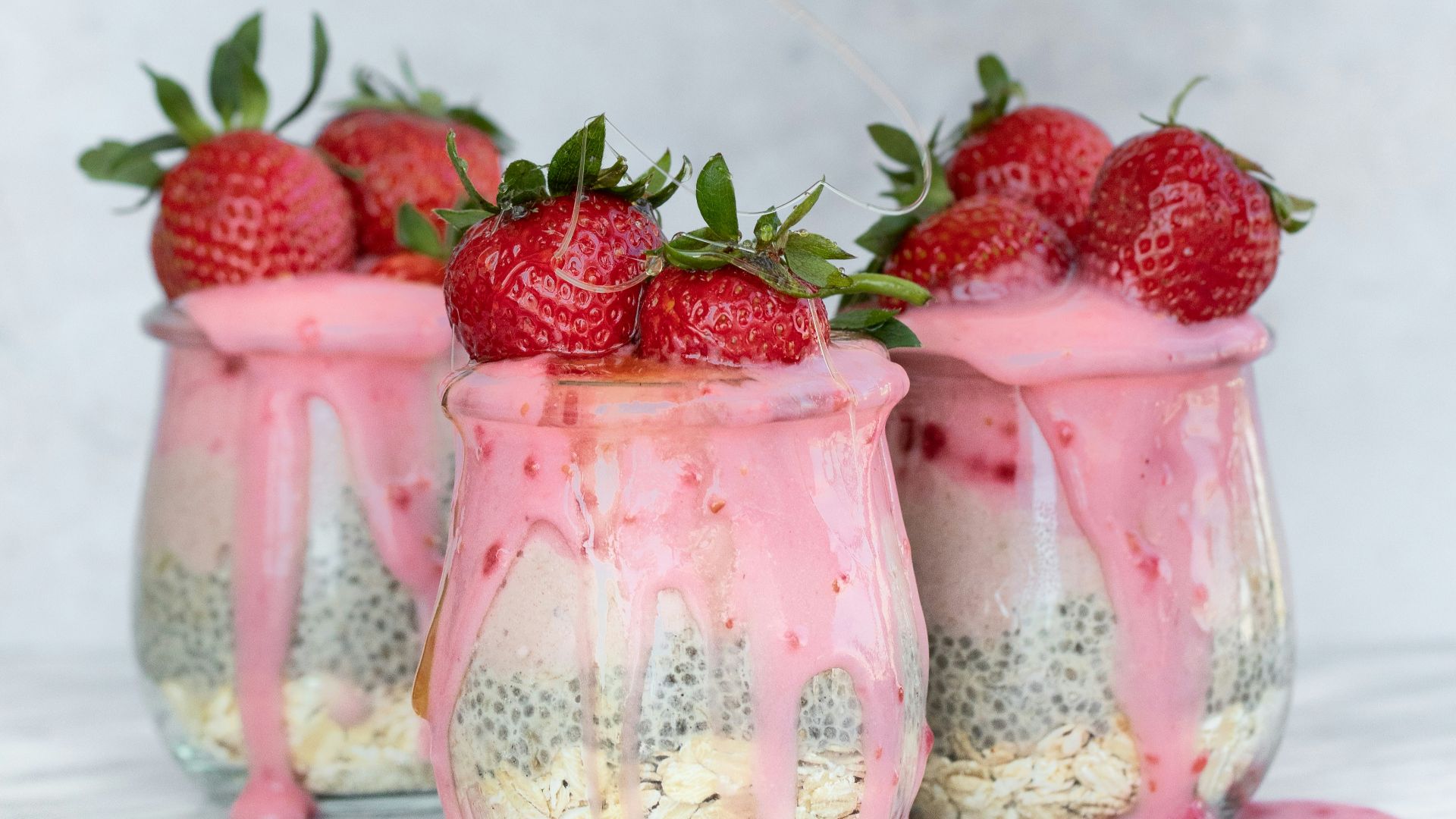 putting honey on strawberry juices