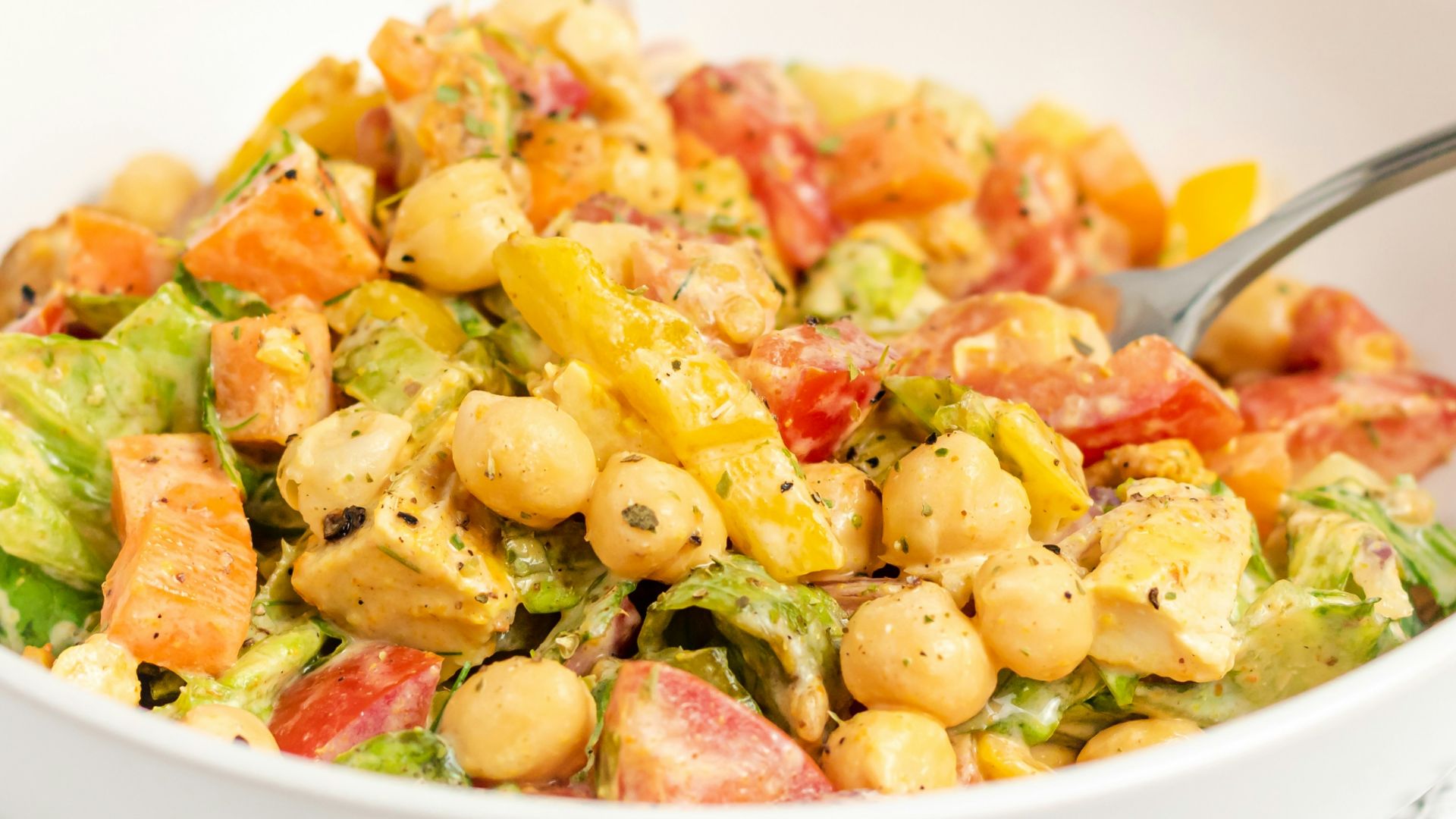 a bowl of food with a spoon in it