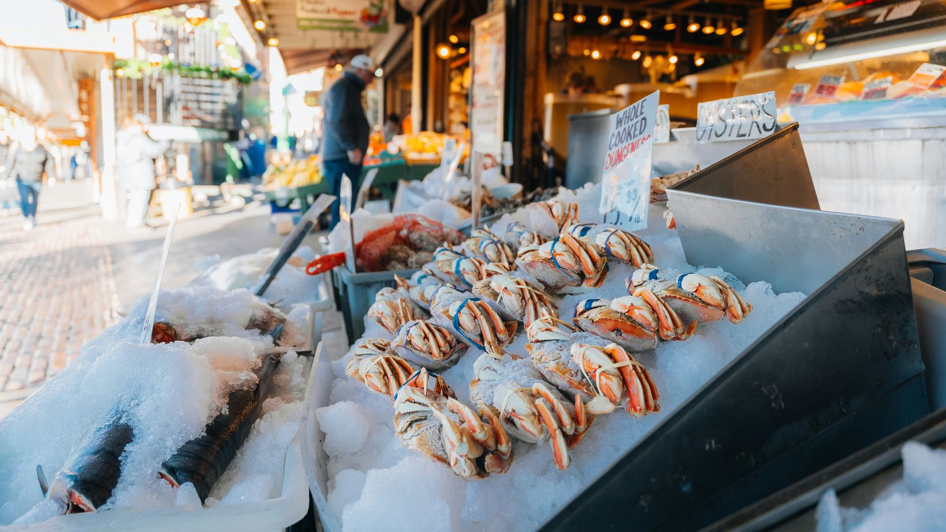 Fresh seafood displayed on ice at a market.