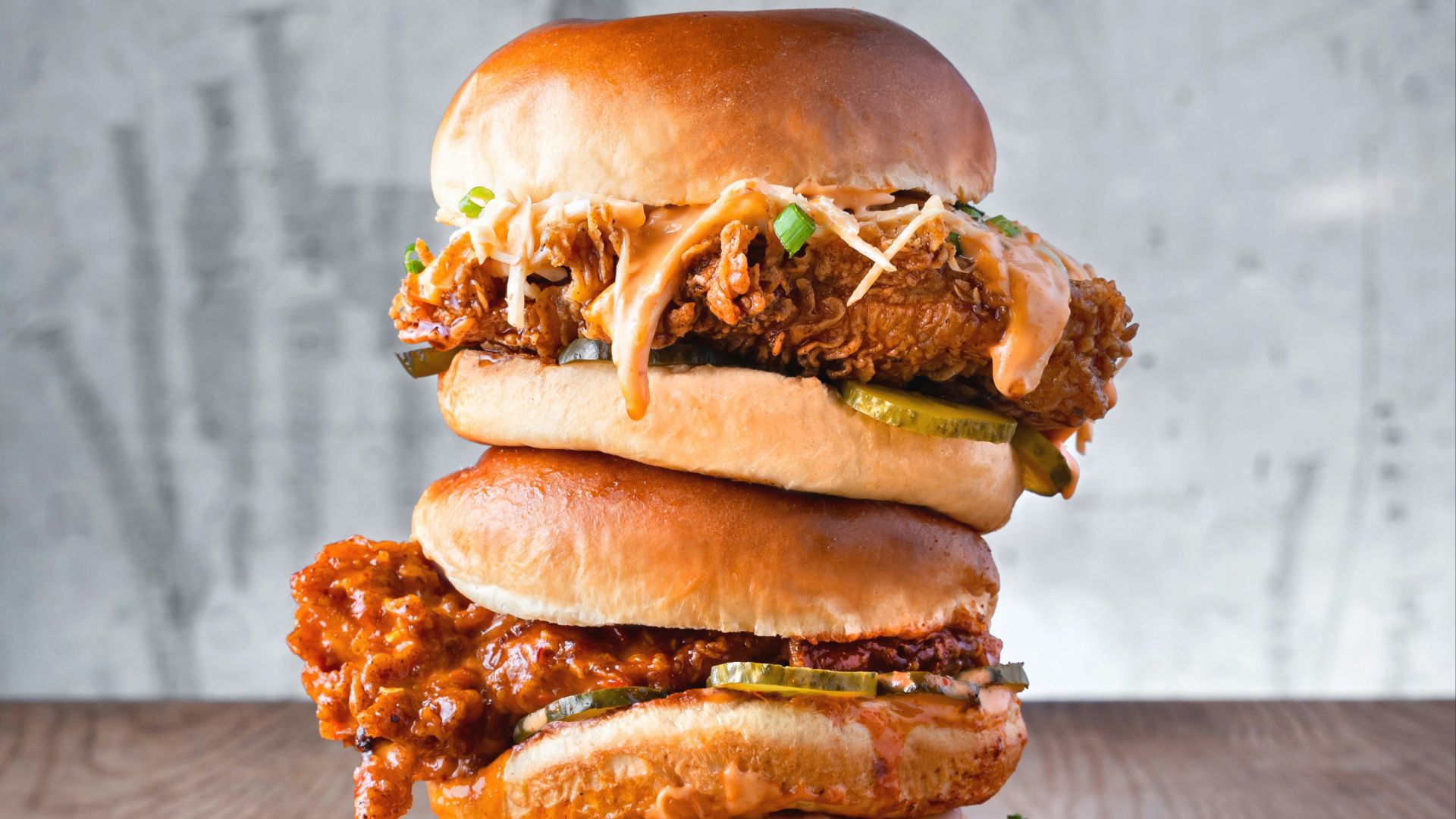 burger with lettuce and fries on brown wooden table