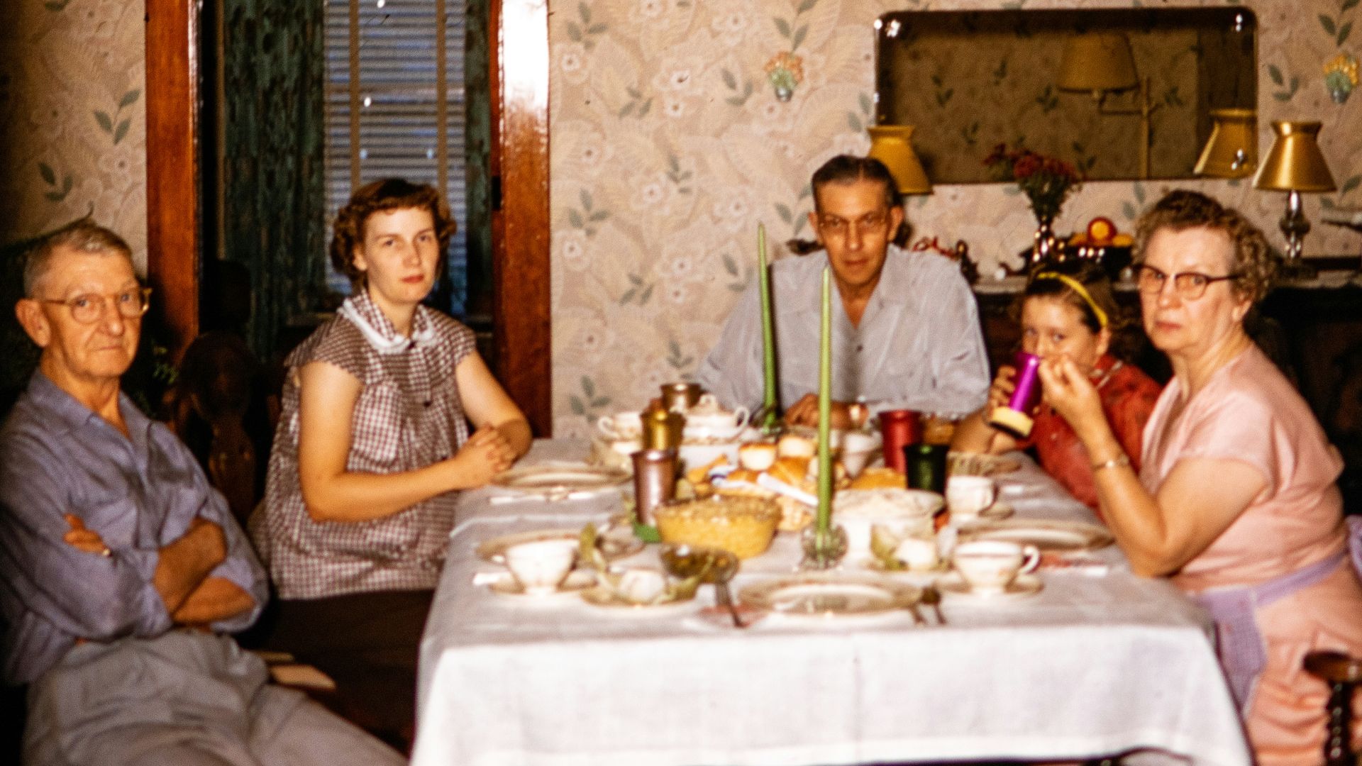 a group of people sitting around a dinner table