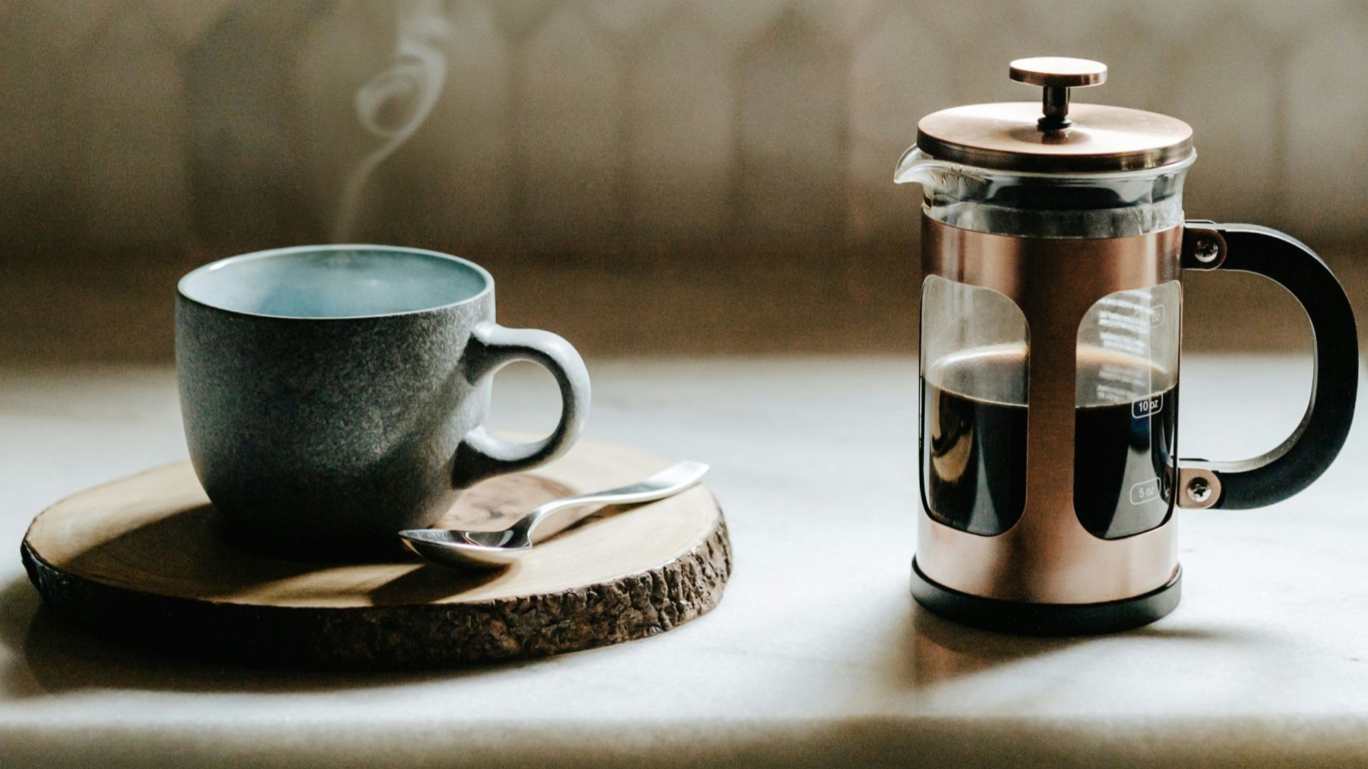 A cup of coffee sitting on top of a kitchen counter