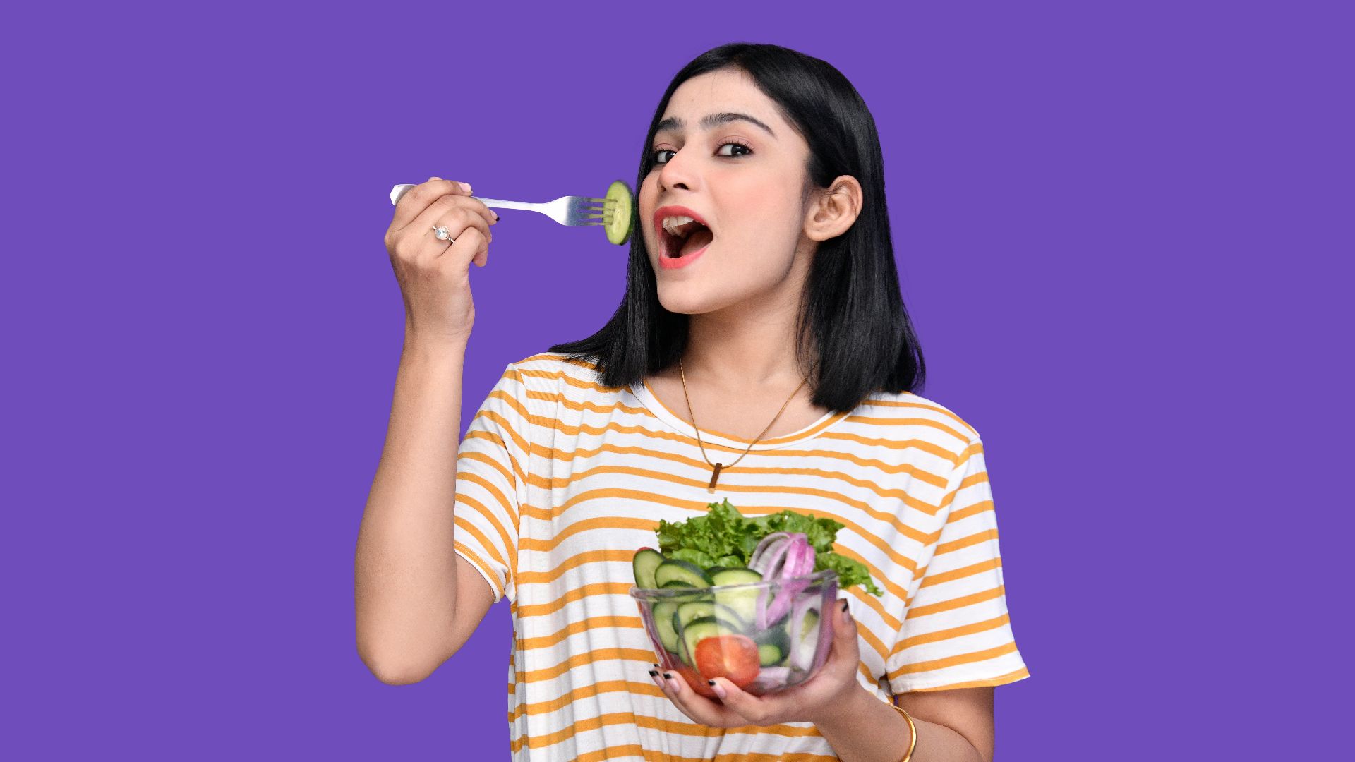 a person holding a bowl of fruit