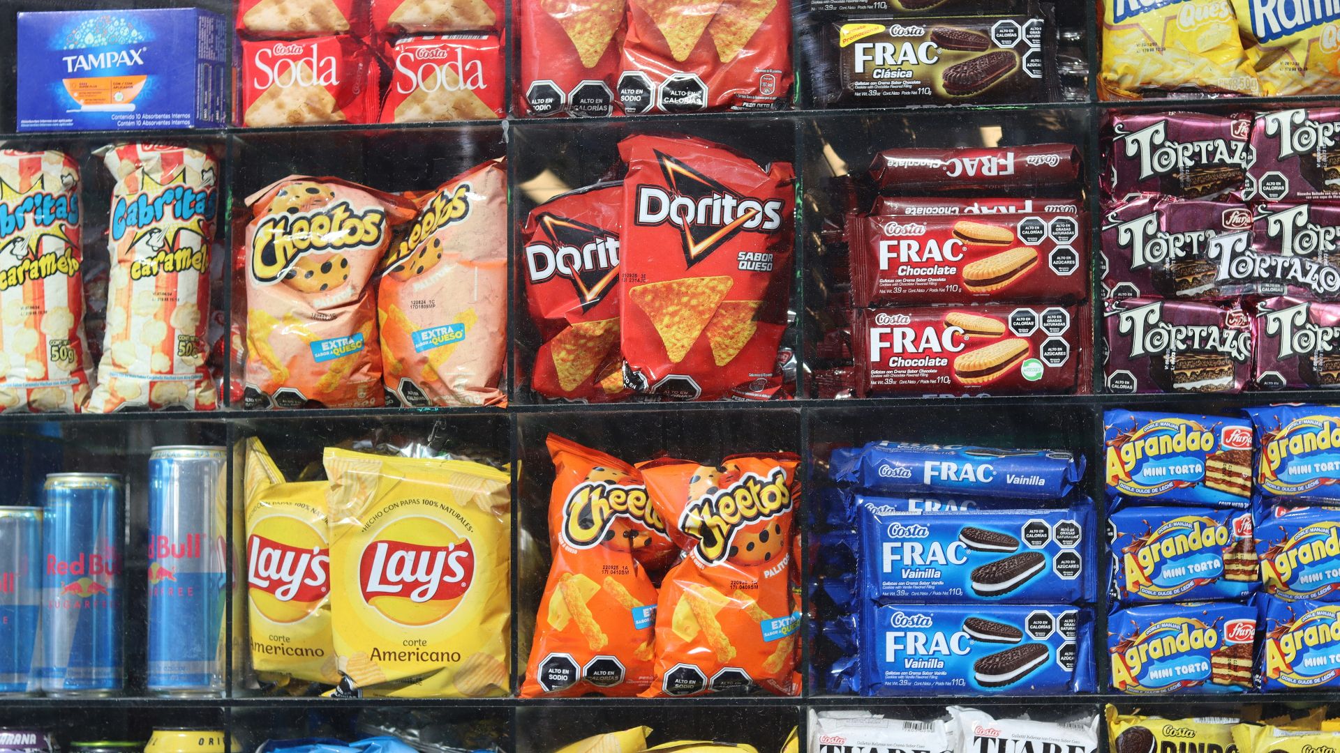Shelves are filled with various snacks and drinks.