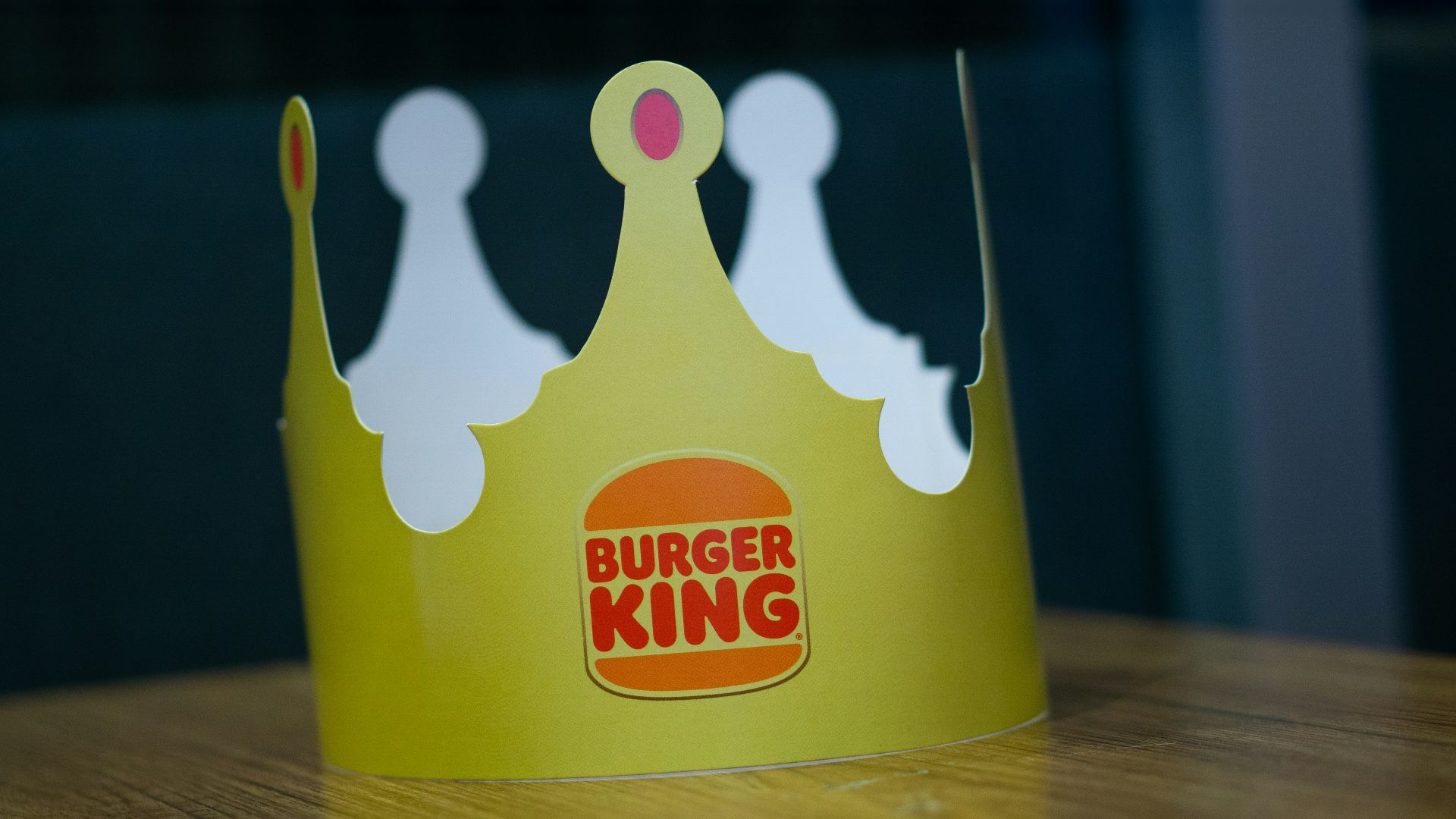 a paper crown sitting on top of a wooden table