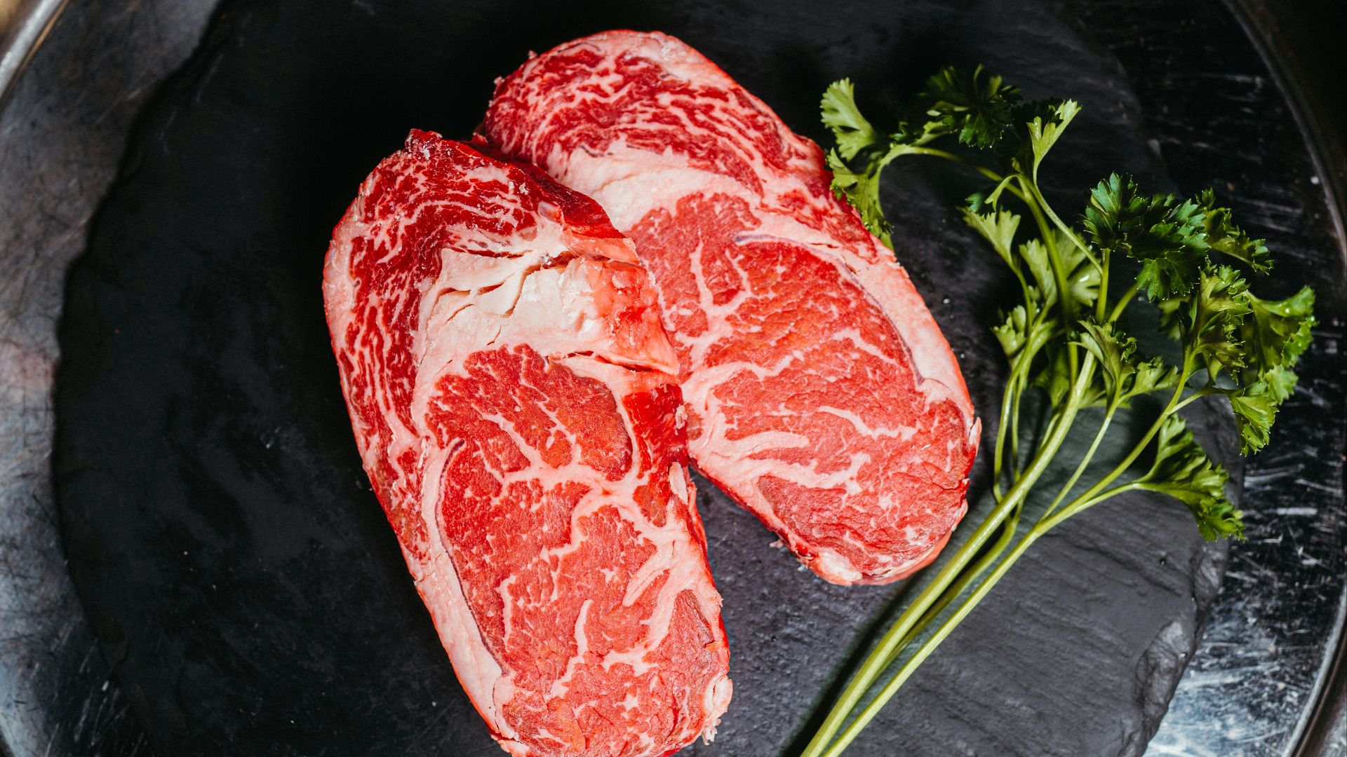a couple of raw meat sitting on top of a pan