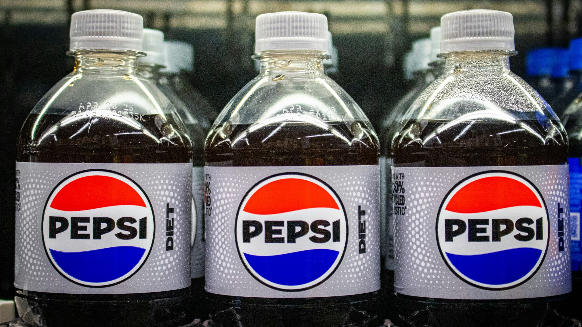 Diet pepsi bottles in a row.