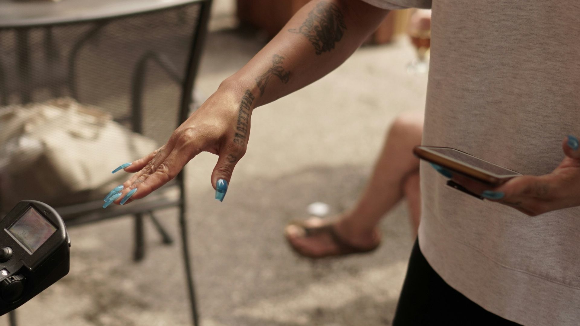 a person holding a cell phone in their hand