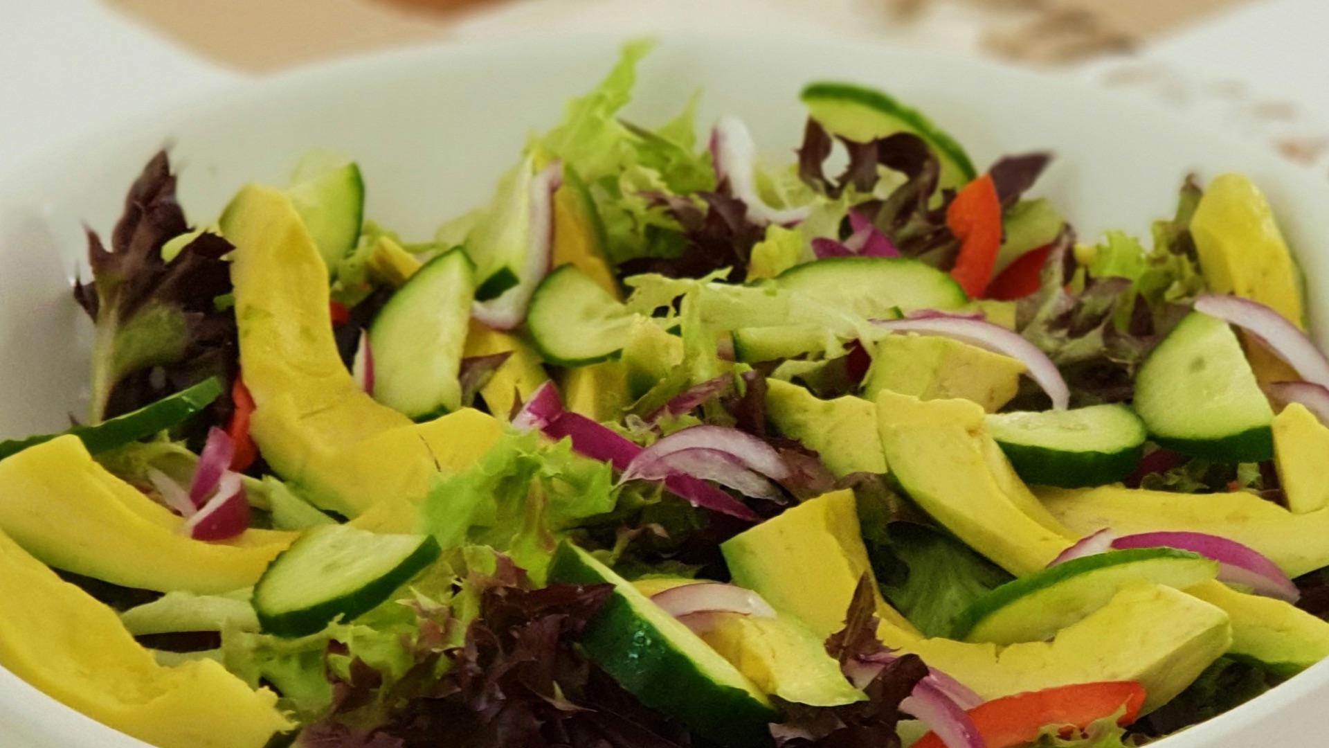 sliced vegetables in ceramic bolw