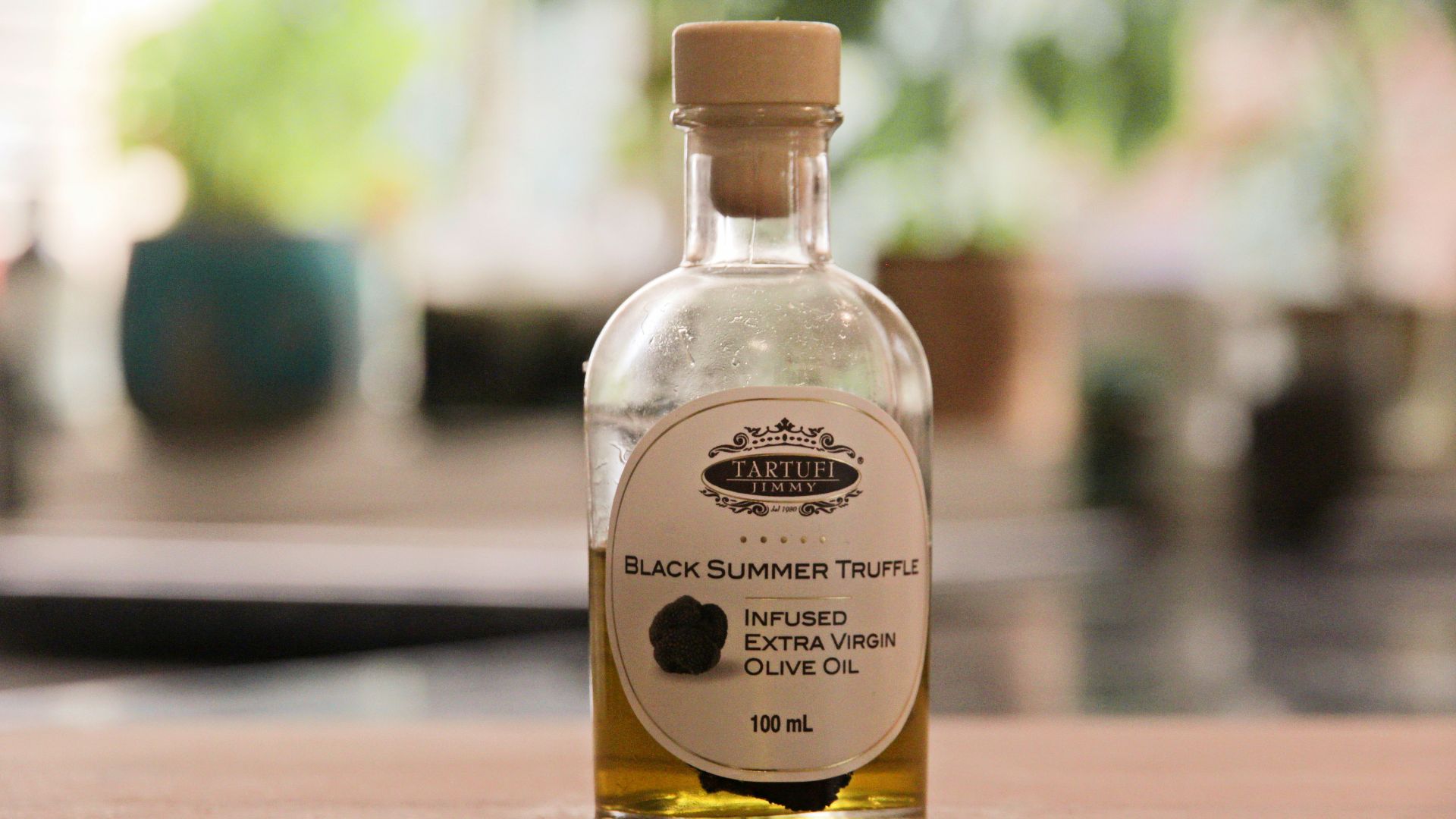 a bottle of black sesame seed oil sitting on a table