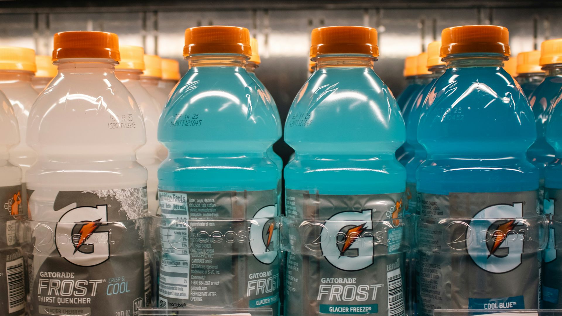Gatorade frost bottles are displayed in a store.