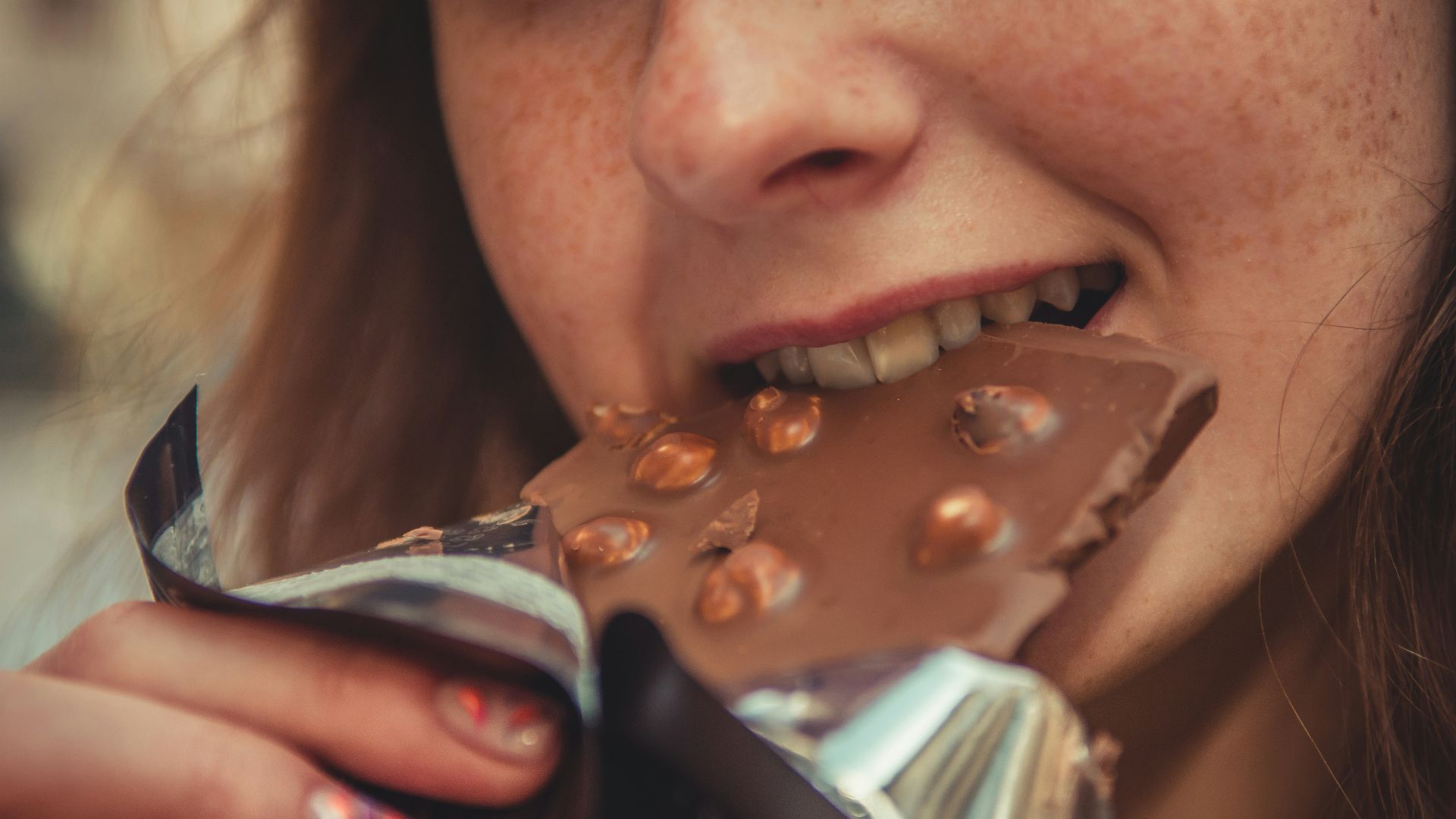 woman eating chocolate