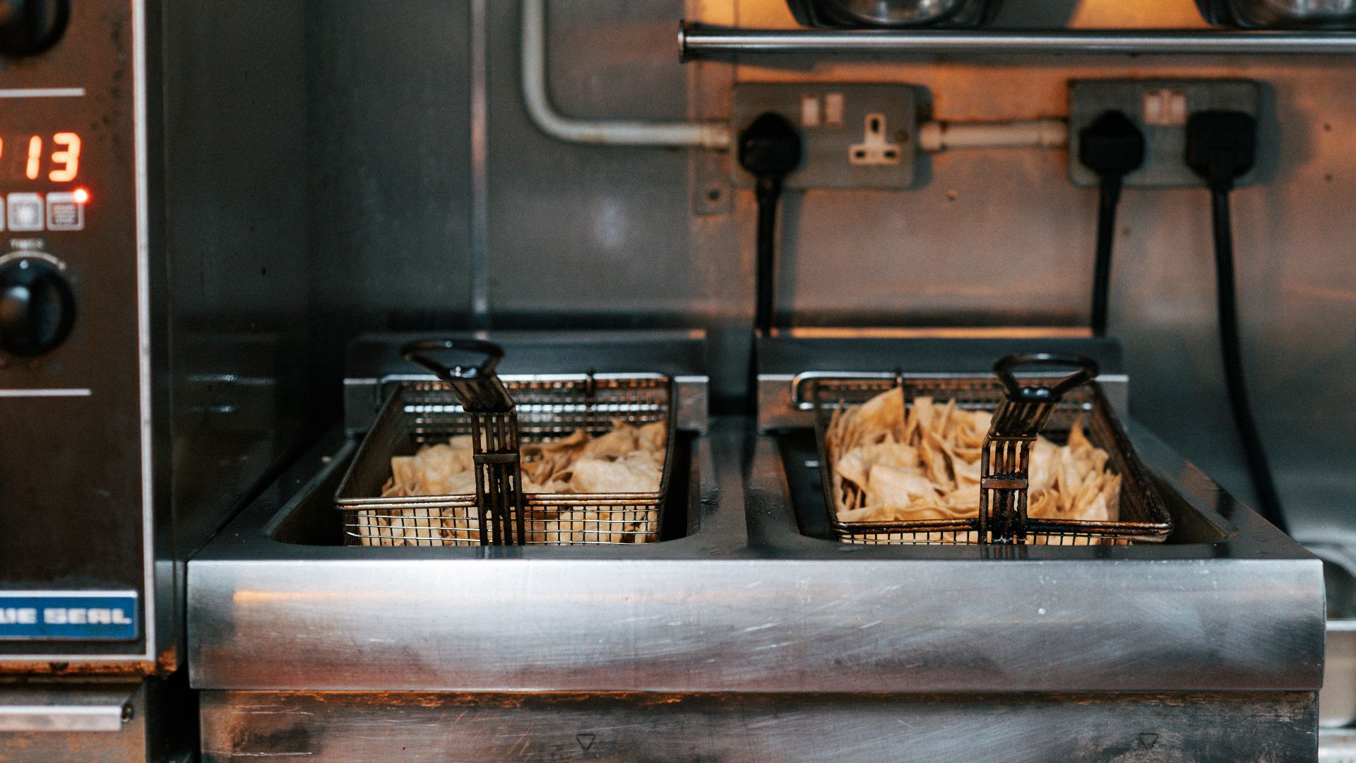 A commercial kitchen with a lot of food in it