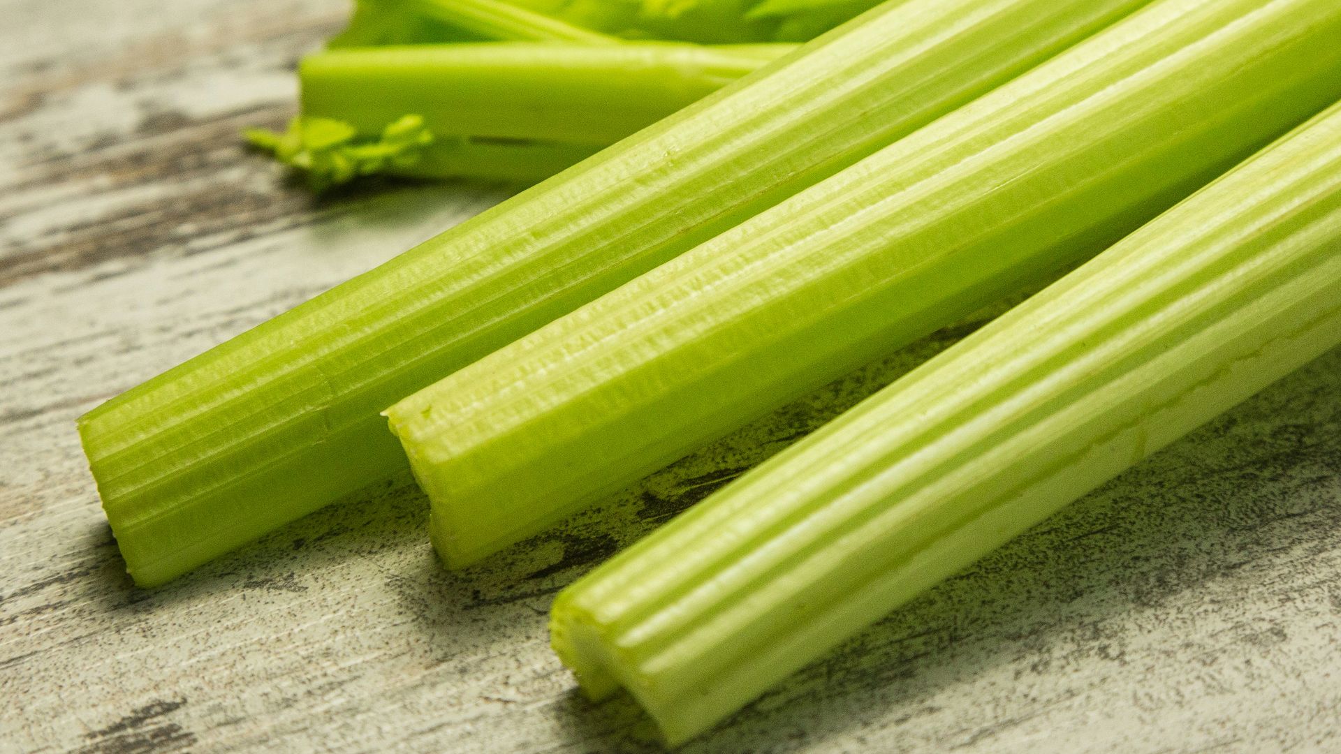 green vegetable on gray wooden table