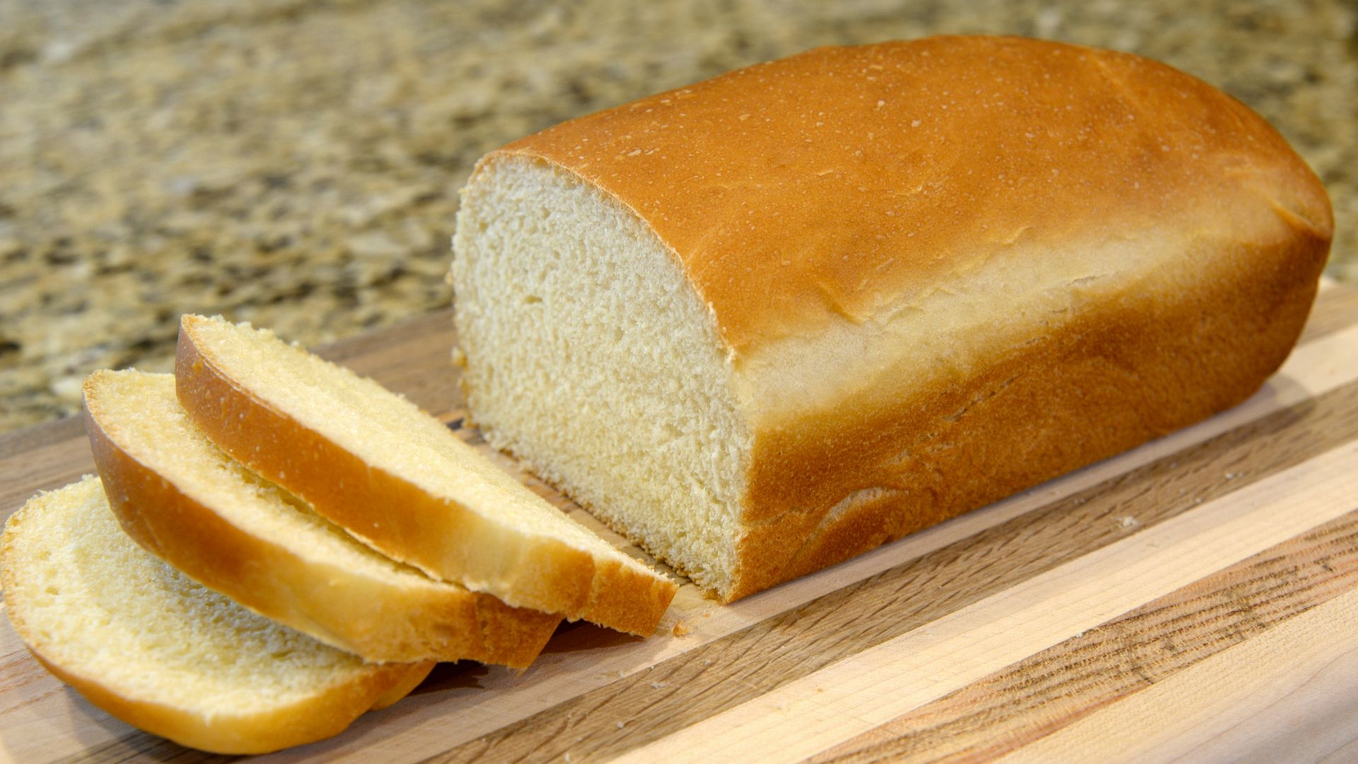 bread on brown wooden chopping board
