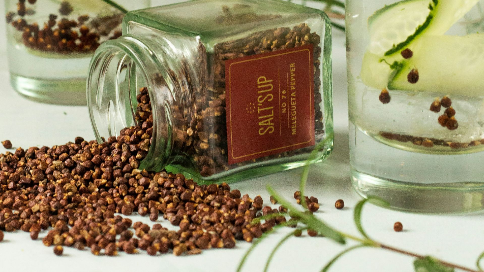 clear glass bottle with brown liquid inside