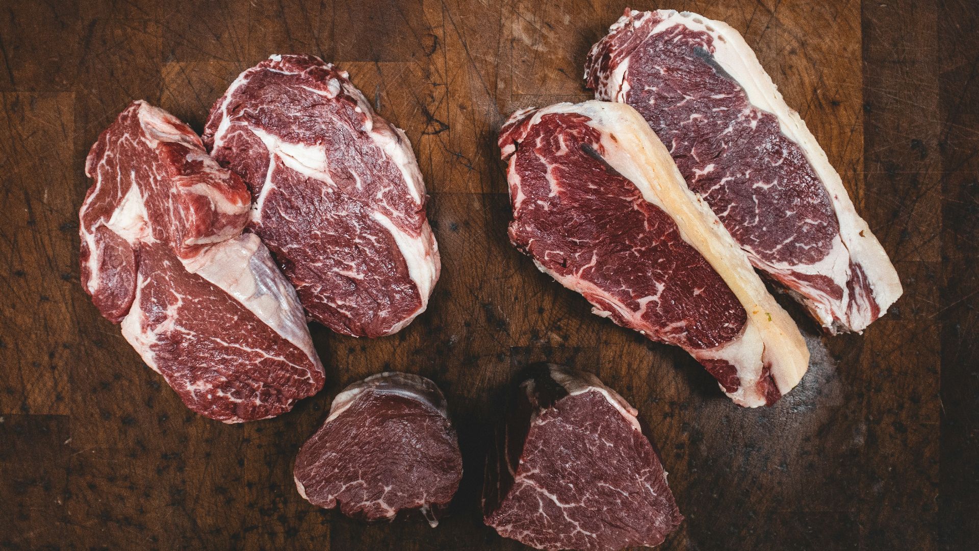 sliced meat beside silver knife