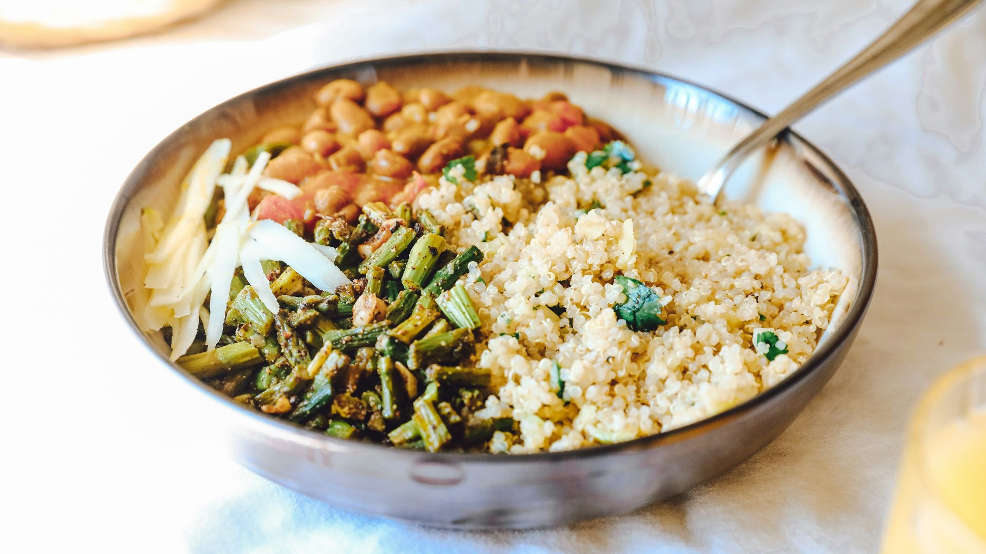 cooked rice with green peas and carrots on stainless steel bowl