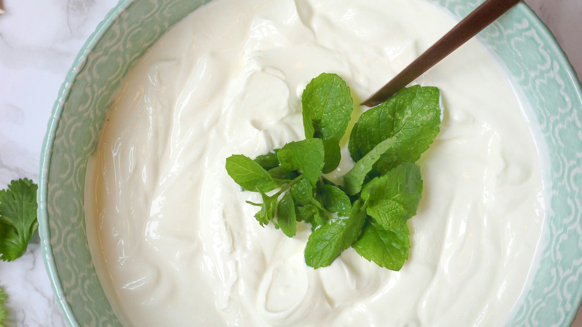 a bowl of yogurt with a spoon in it