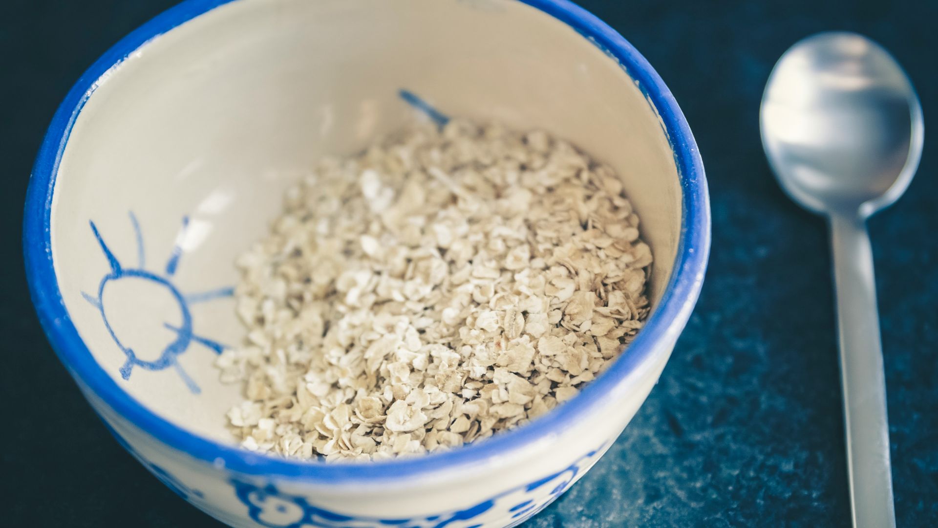 cereals in blue and white ceramic bowl