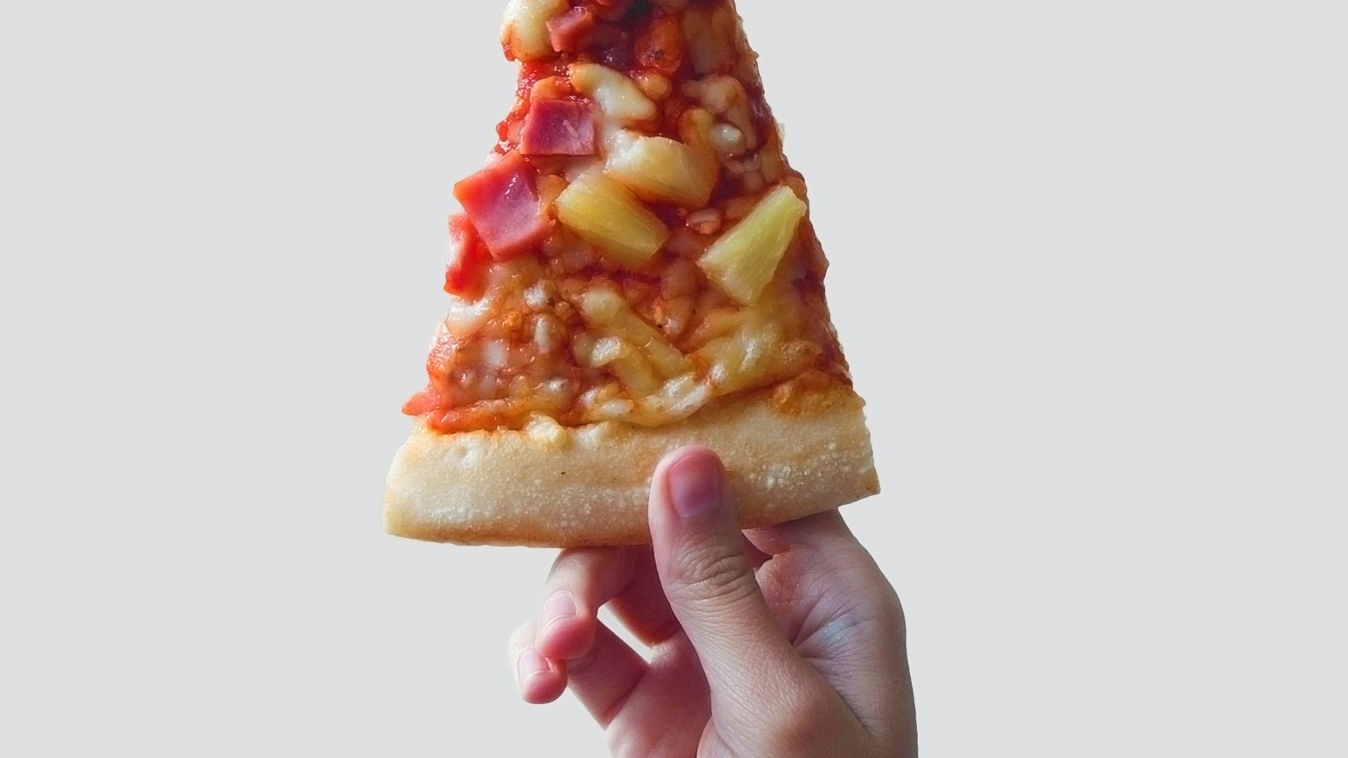 person holding sliced pizza