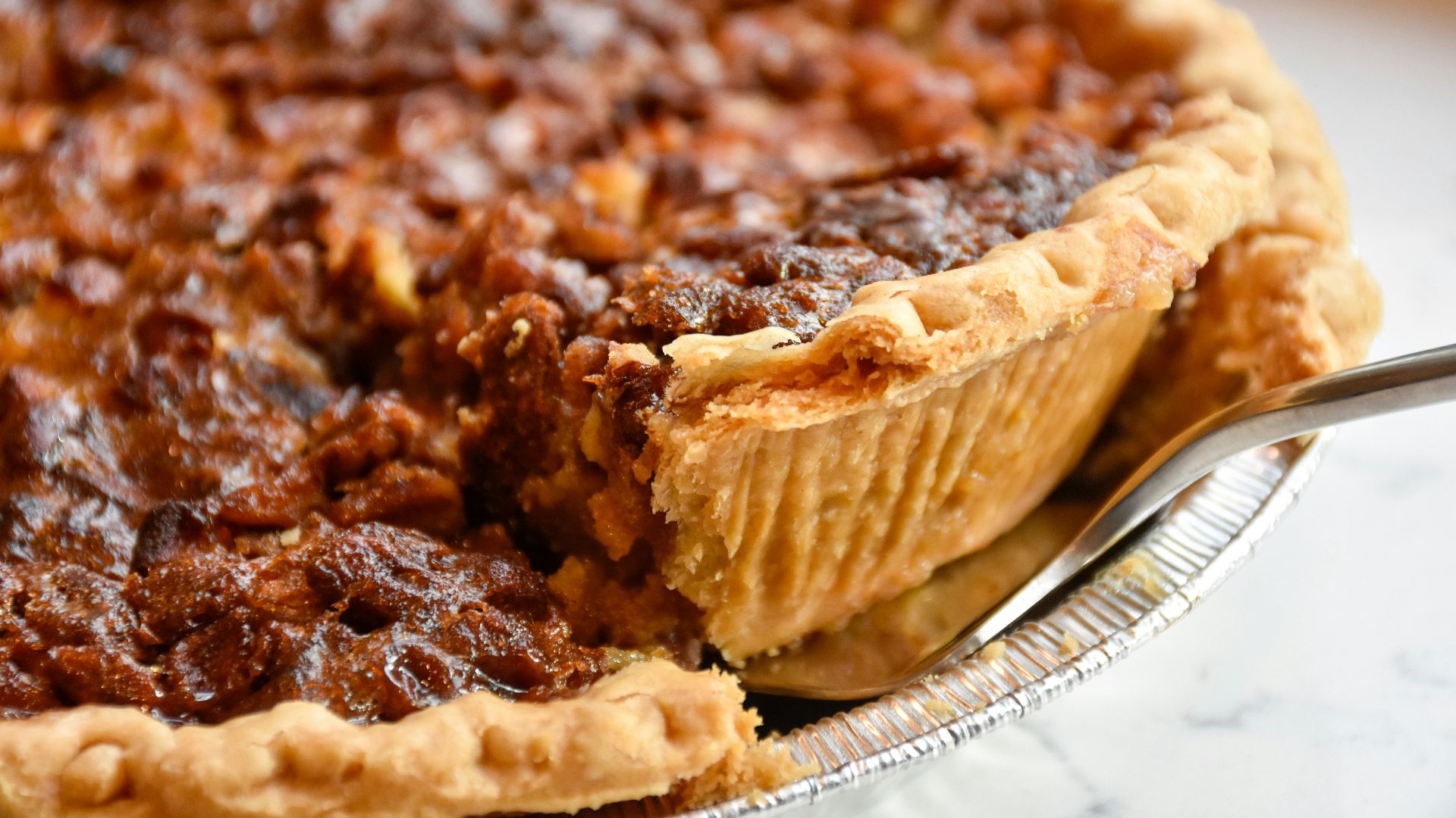 brown pie on white ceramic plate