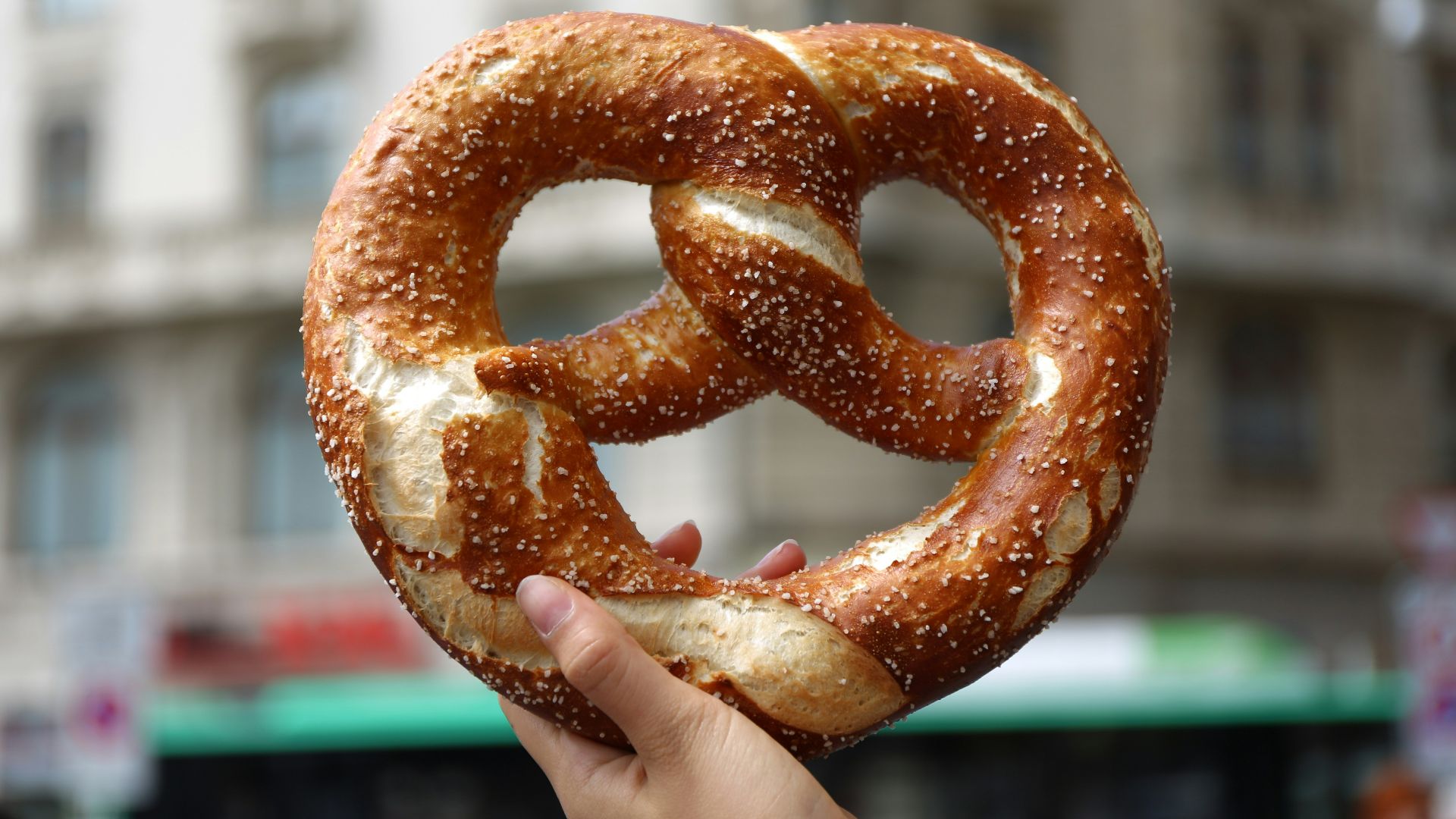 person holding pretzel