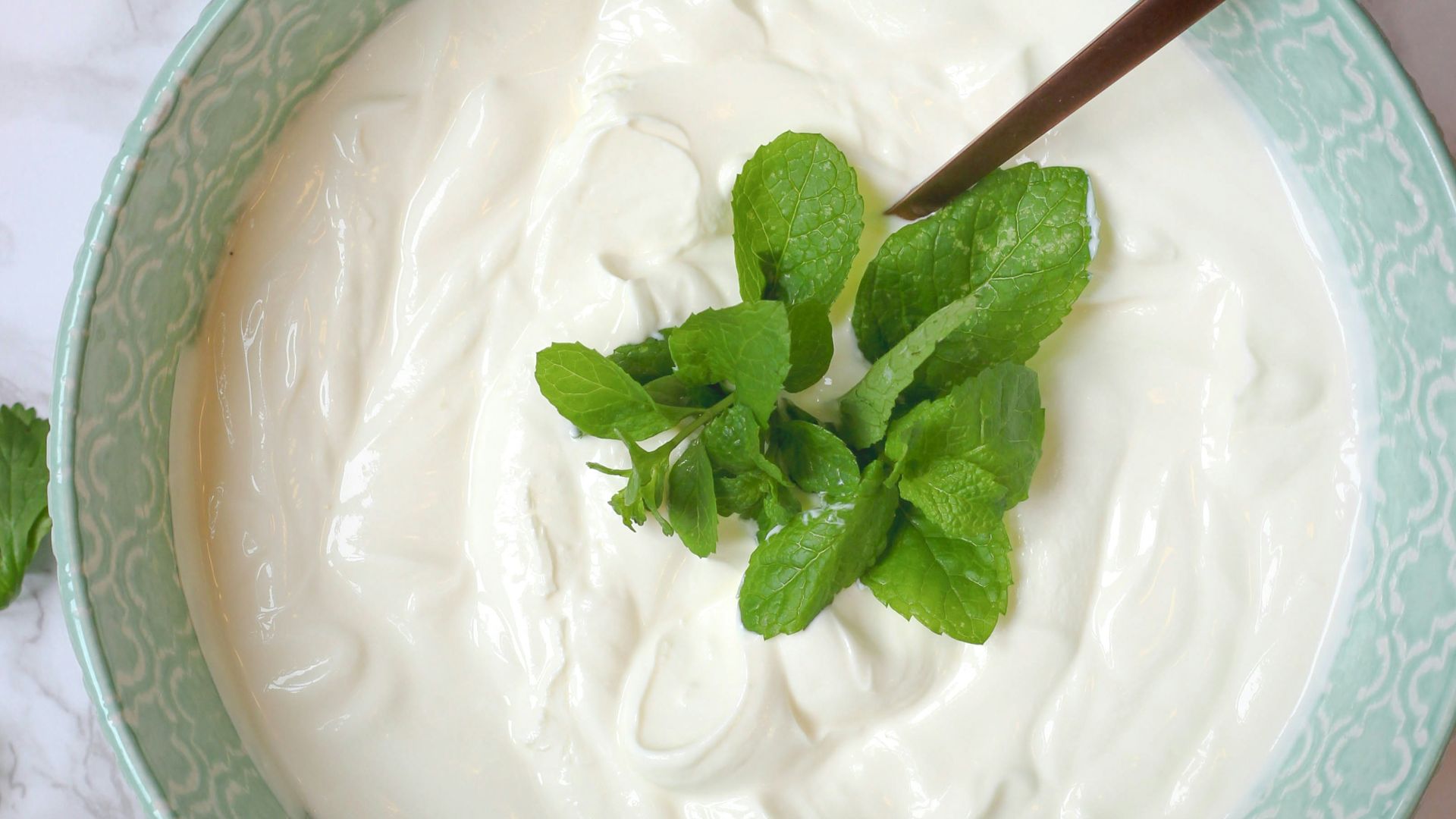 a bowl of yogurt with a spoon in it