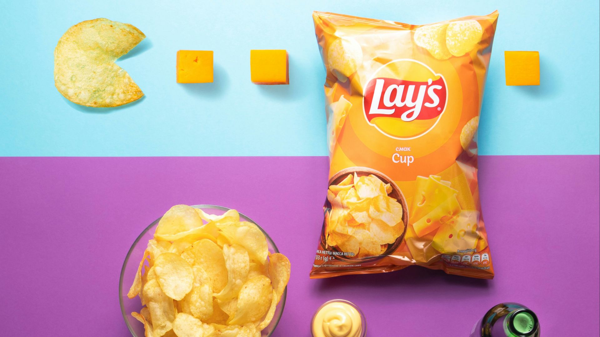 black and silver semi automatic pistol beside orange and yellow plastic pack