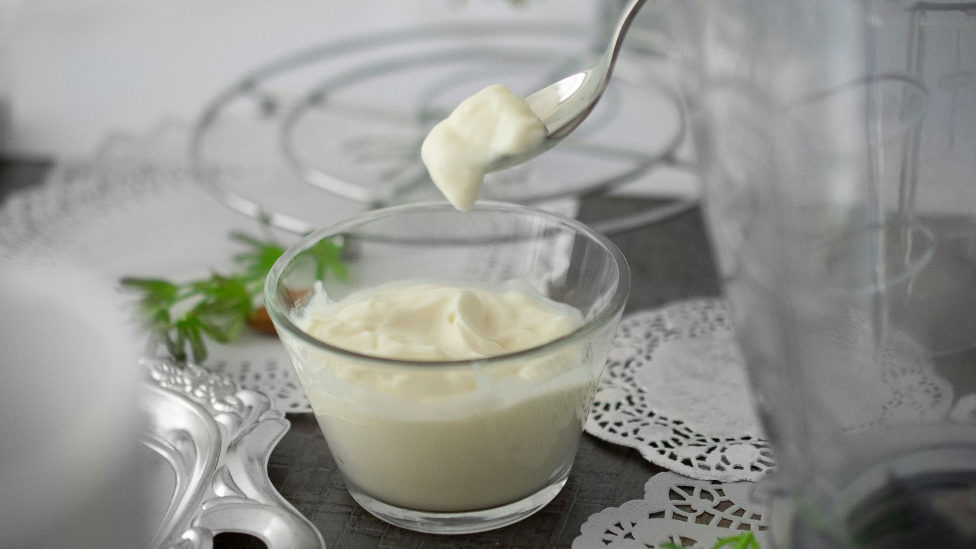 close-up photo of white cream in clear shot glass