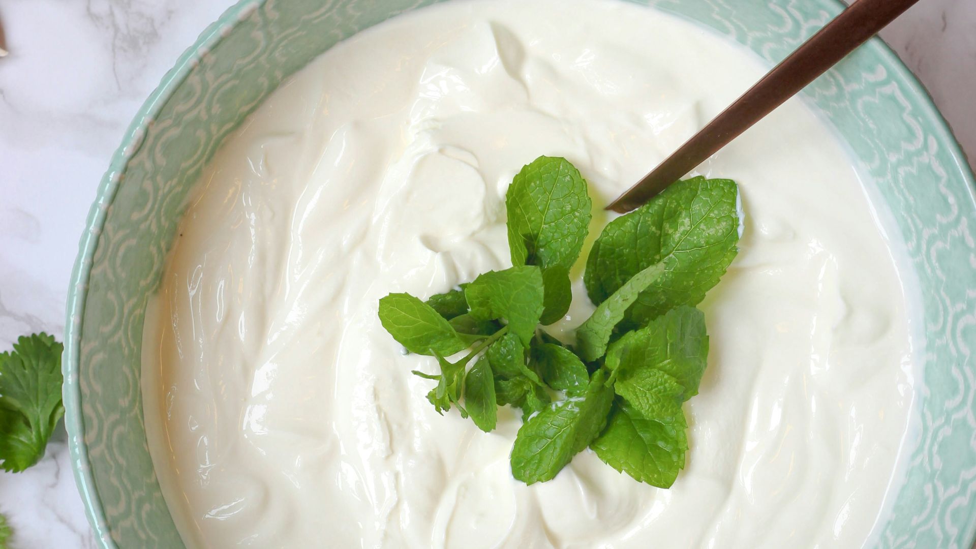 a bowl of yogurt with a spoon in it