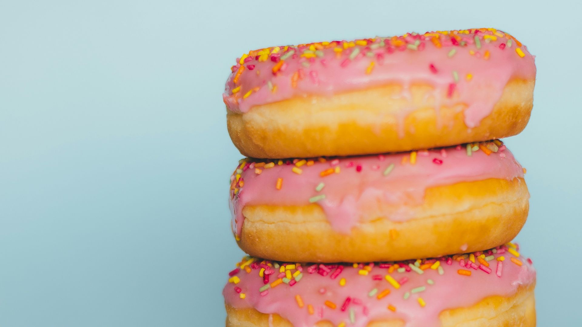 four donuts with sprinkles