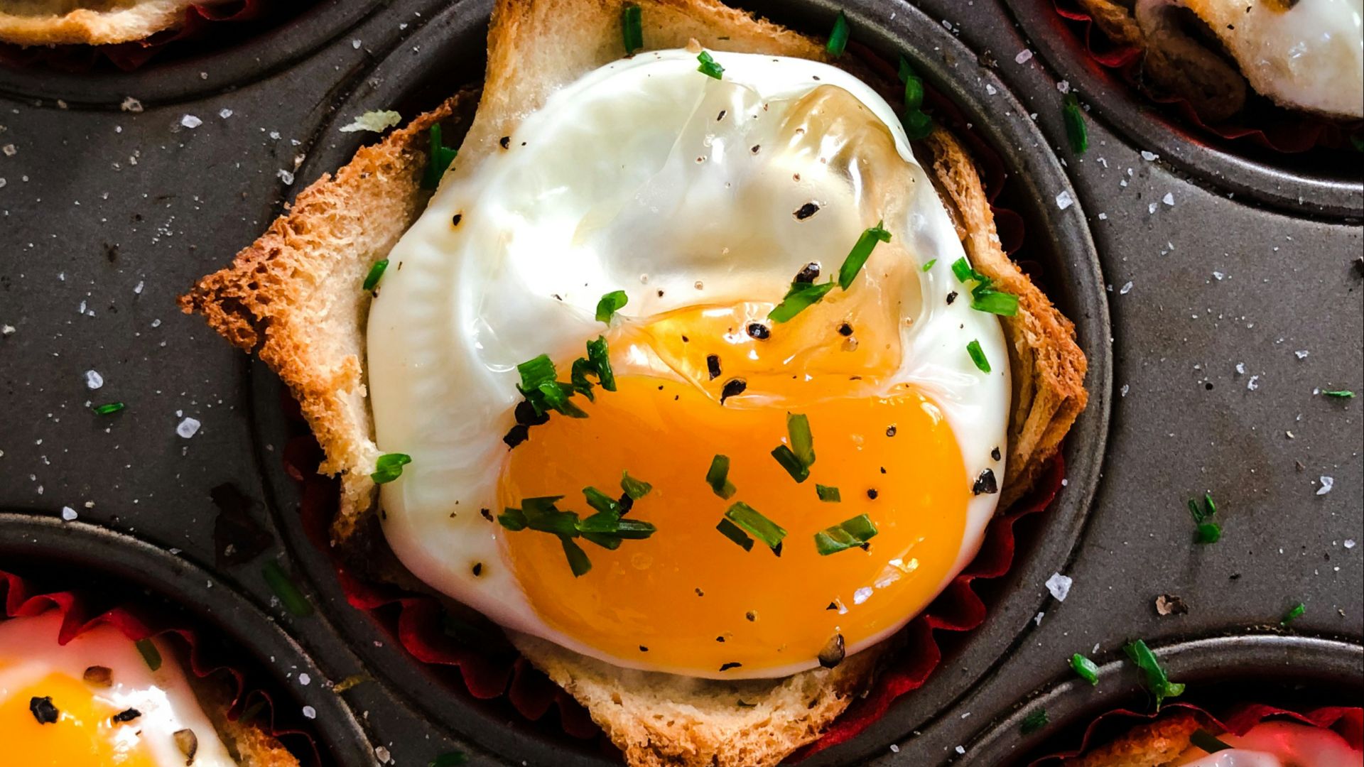 brown and white pastry on black tray