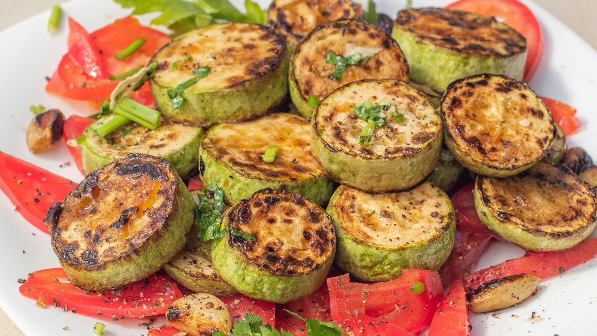 a plate of grilled vegetables on a table