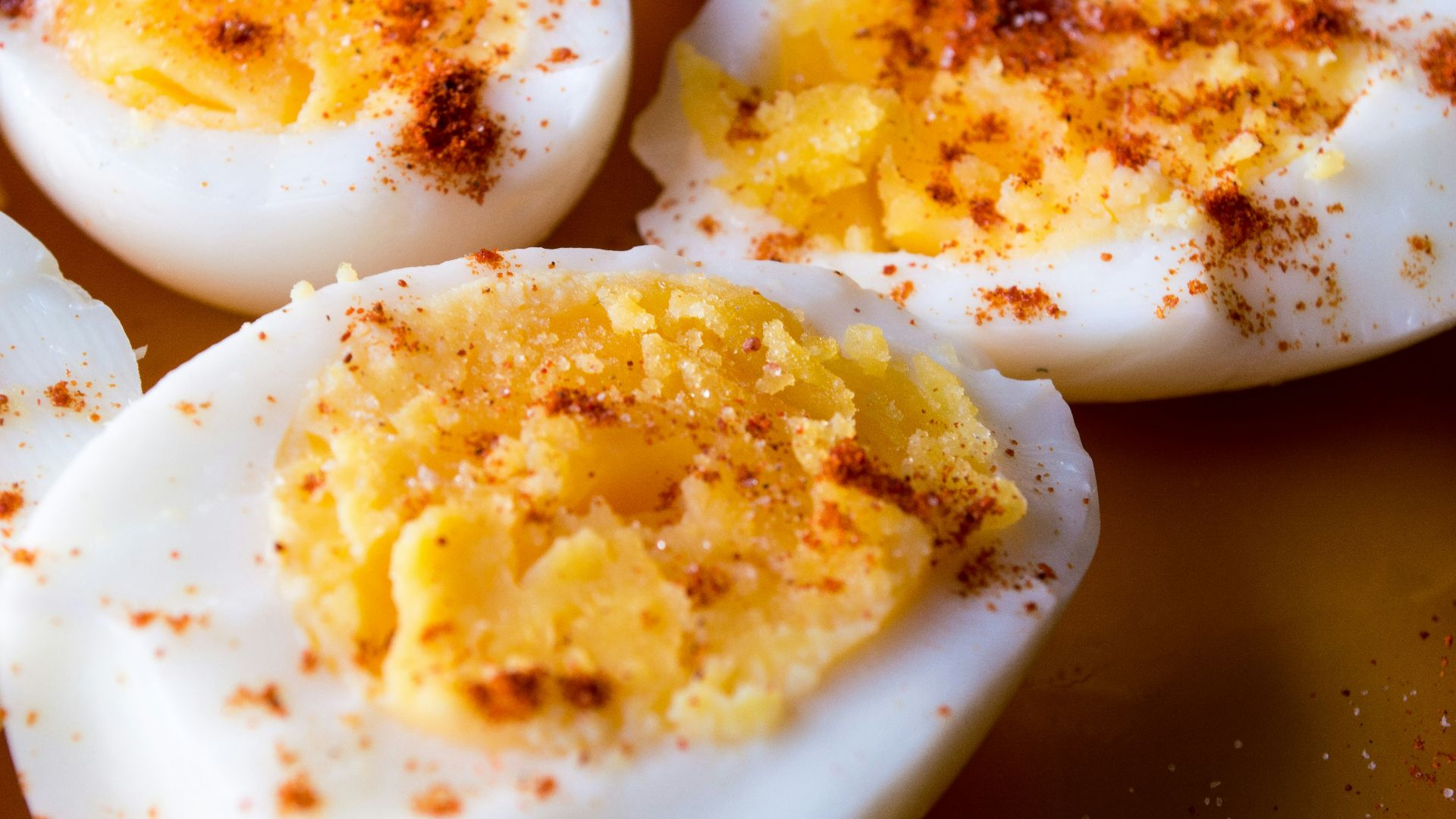 sliced boiled eggs topped with spices