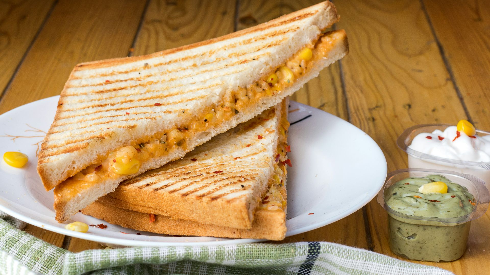 bread with cheese fillings on white ceramic plate