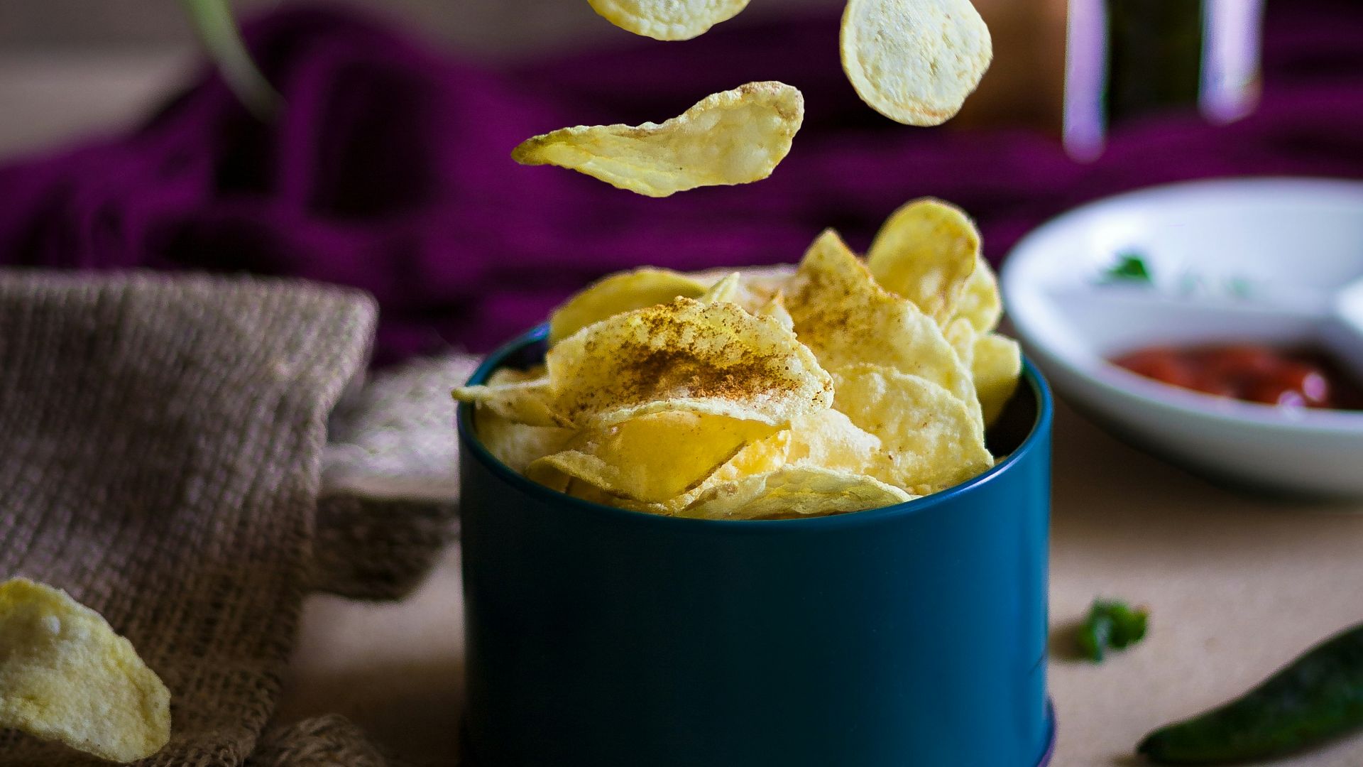 blue ceramic mug on green table cloth