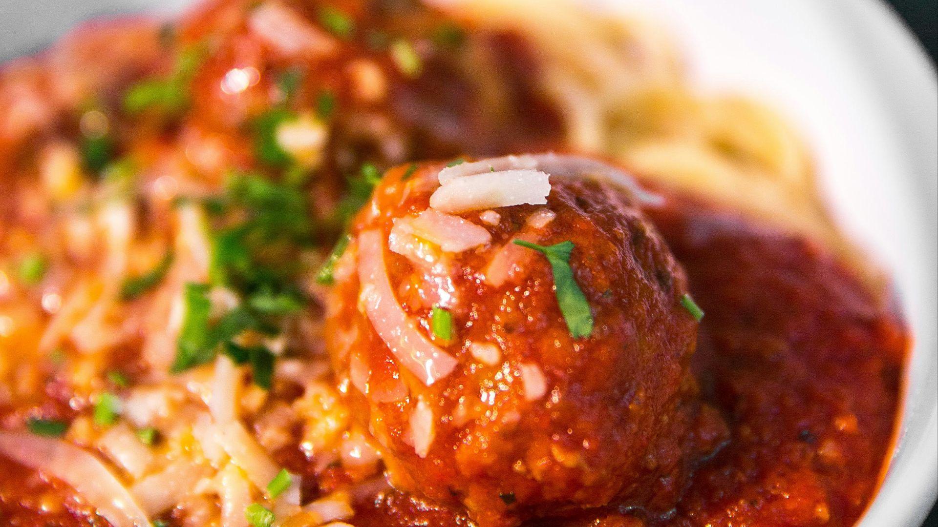 meta balls with noodles served on white ceramic bowl