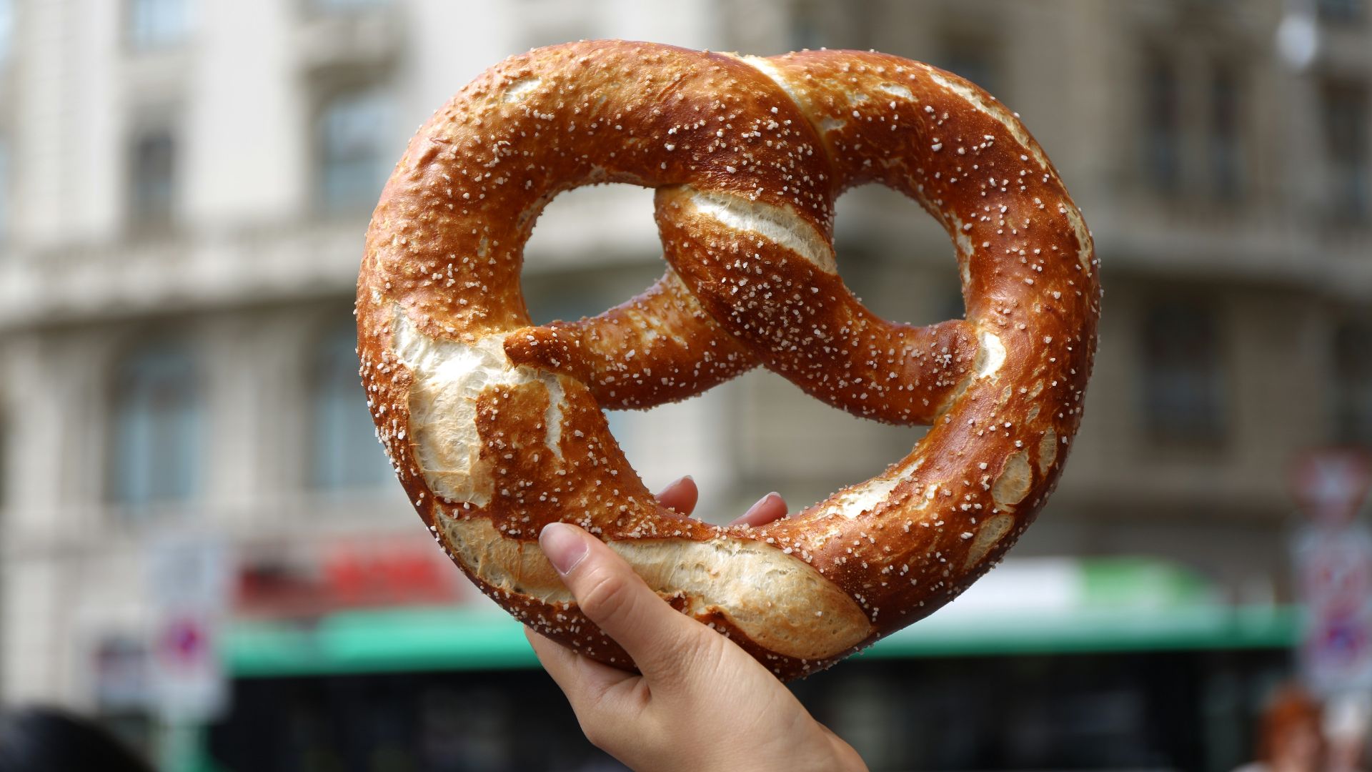 person holding pretzel