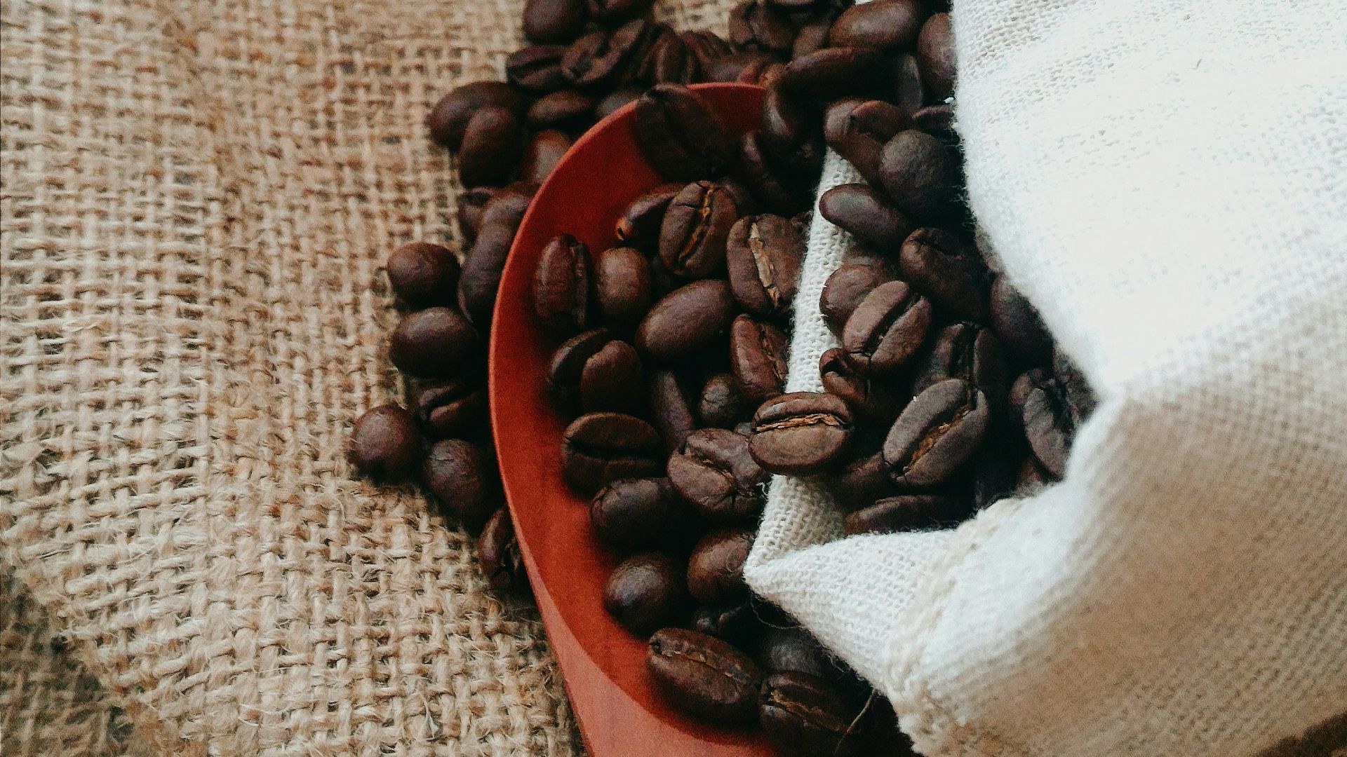 white textile on brown wooden table