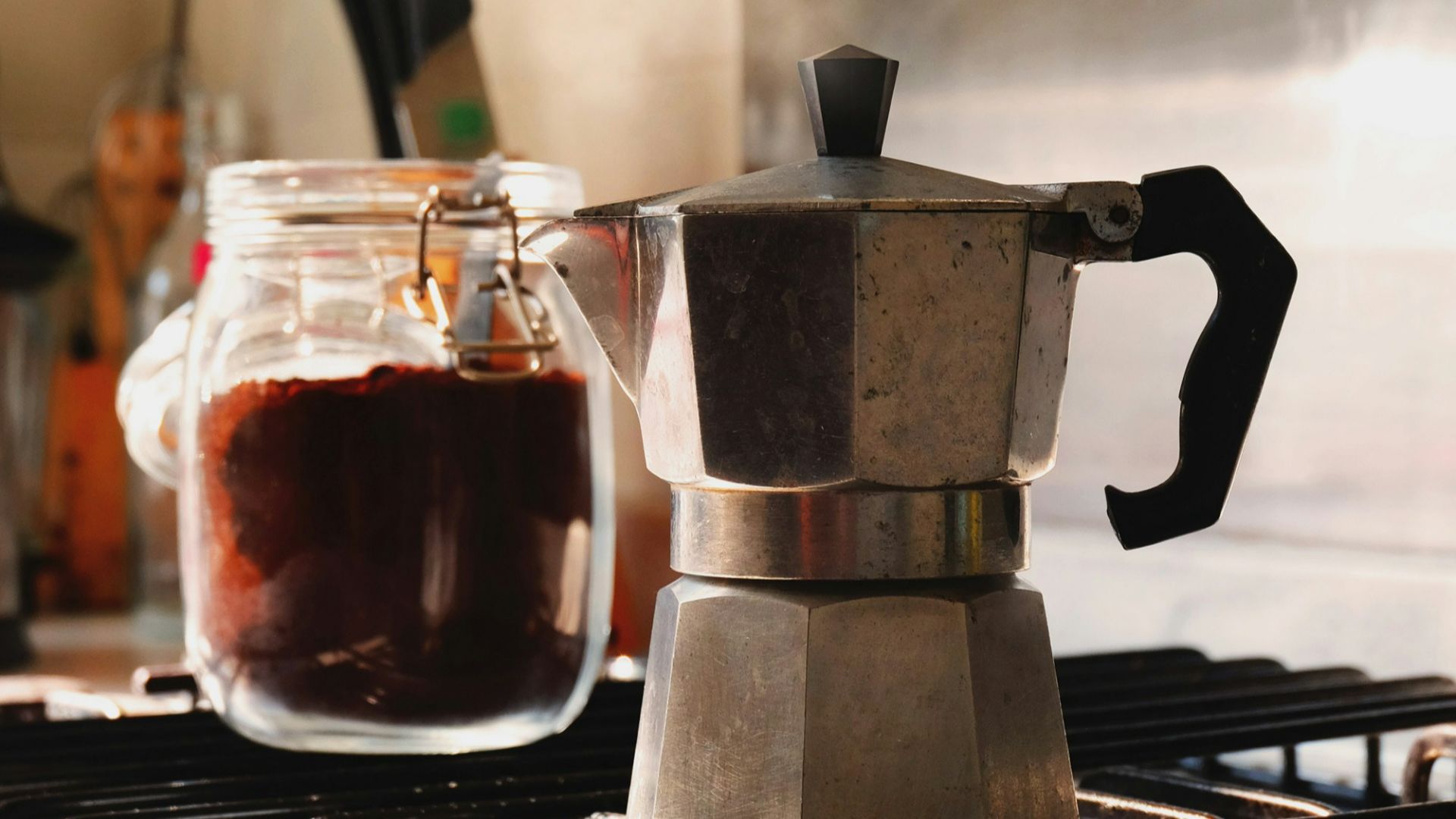 gray and black moka pot on top of gray gas range oven