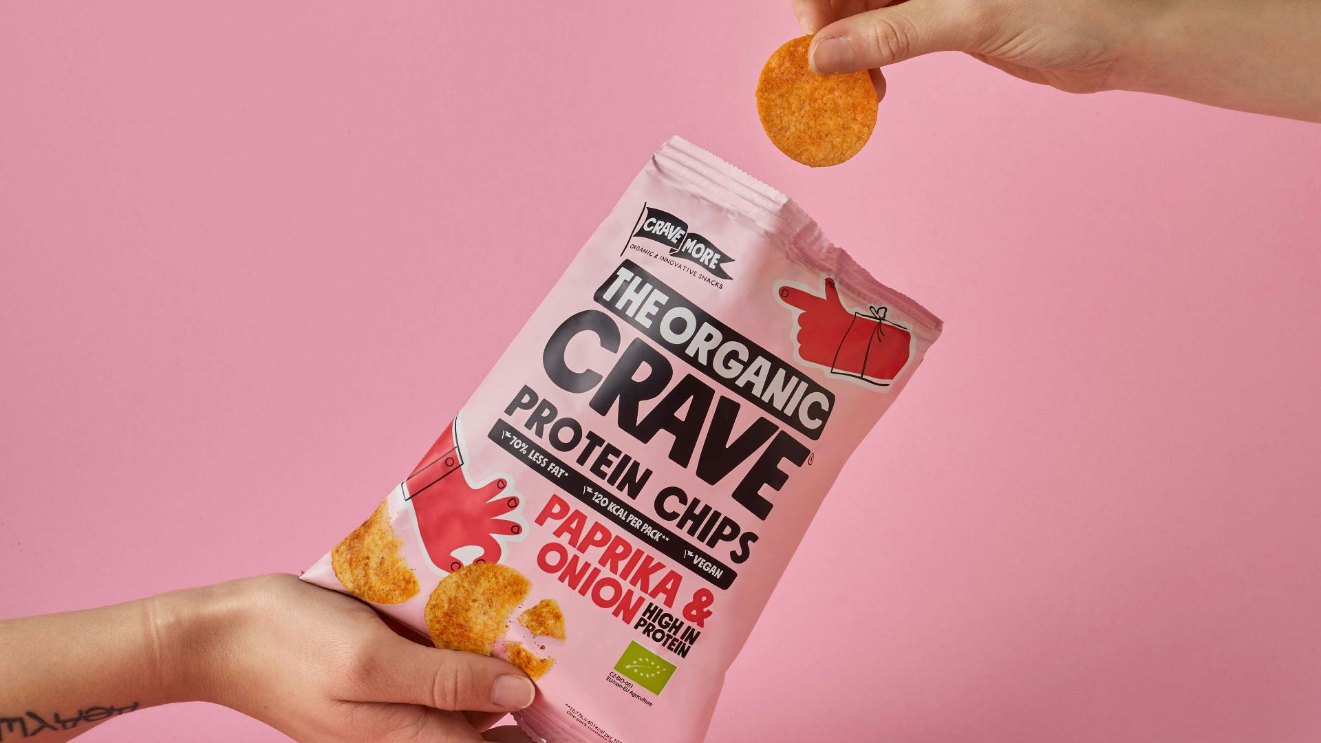 a person is holding a bag of crave crackers
