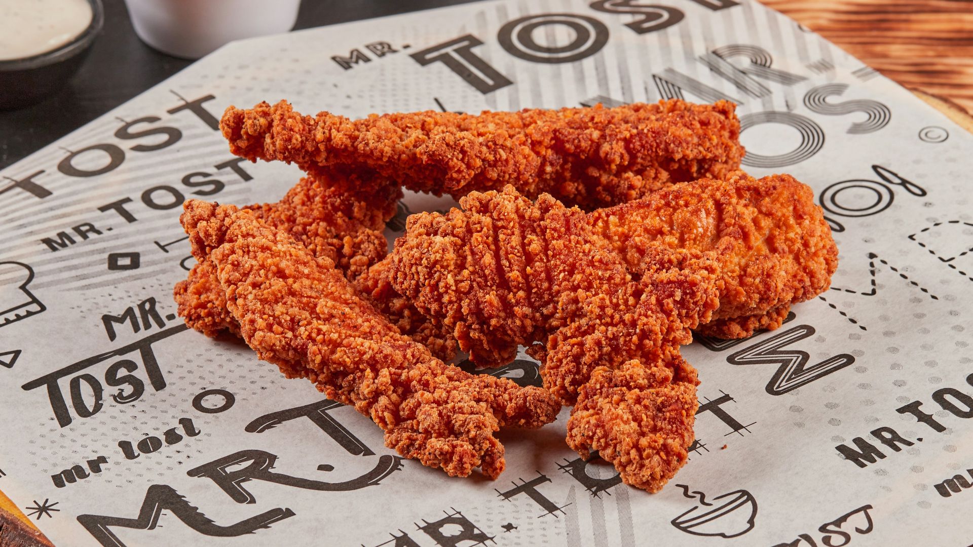 fried chicken on brown wooden chopping board