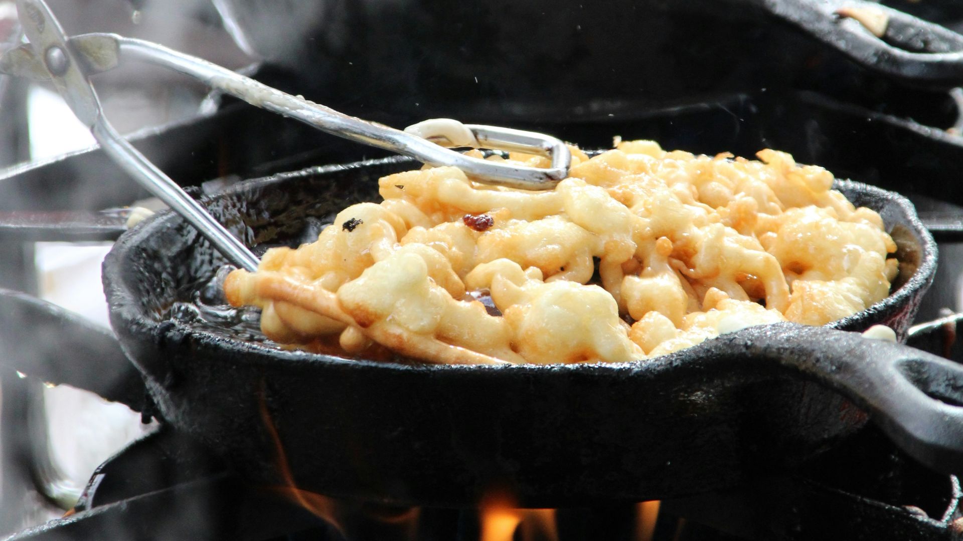 a close up of food cooking on a grill