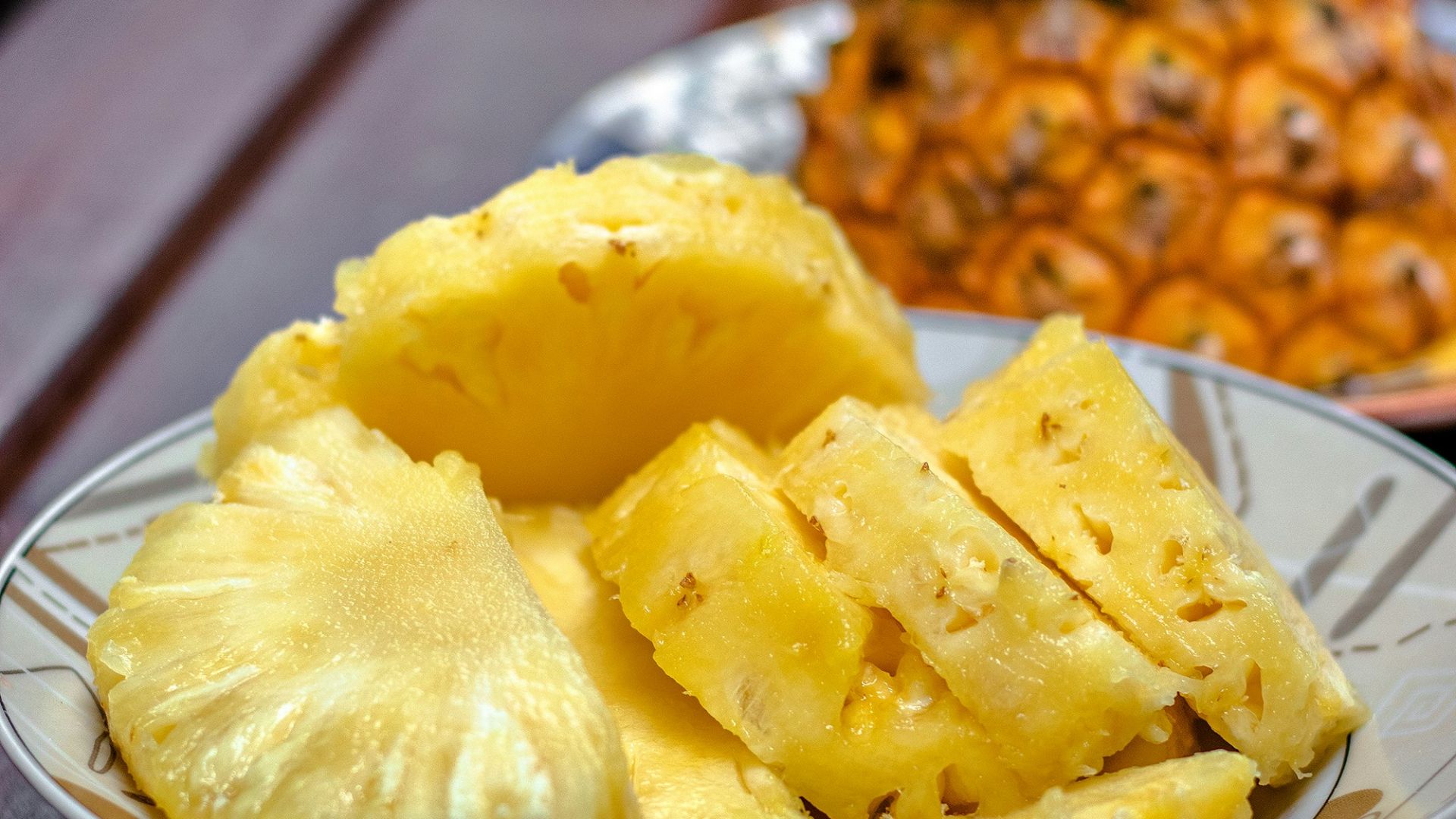 sliced pineapple on white ceramic plate