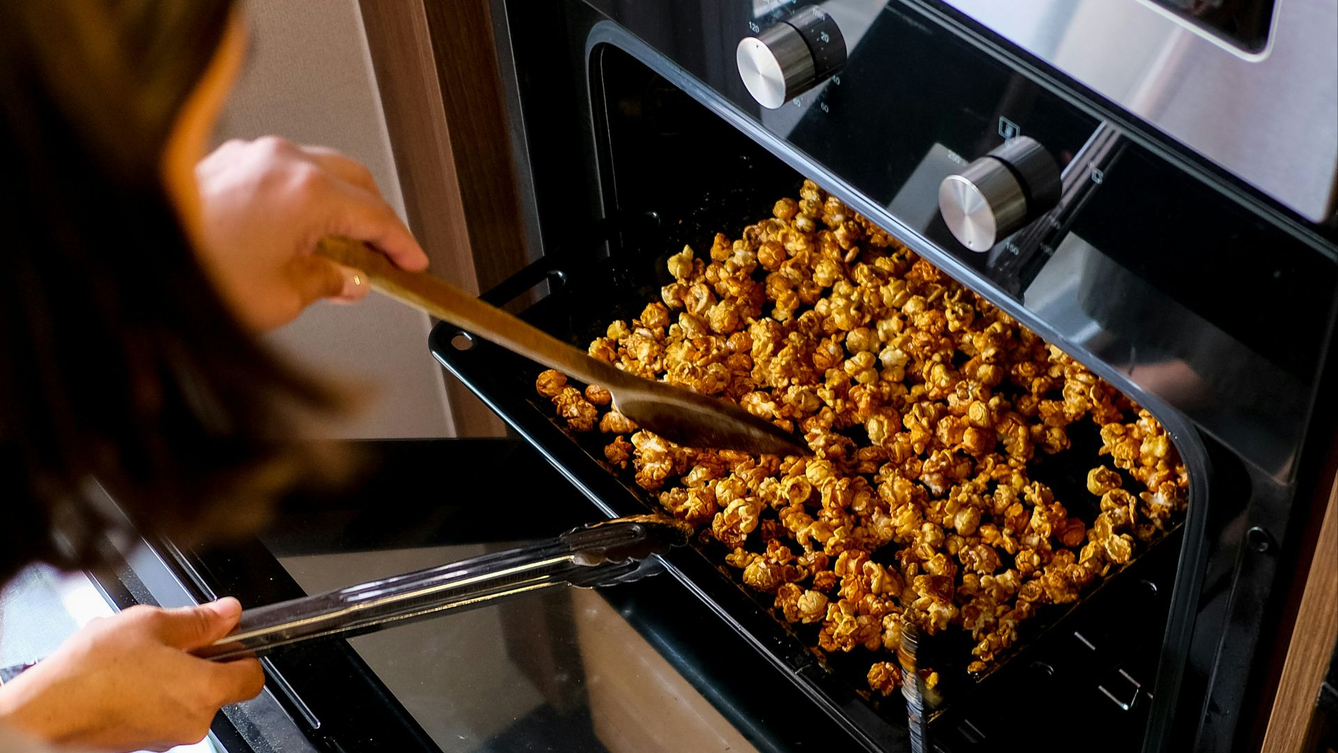 person holding brown wooden stick
