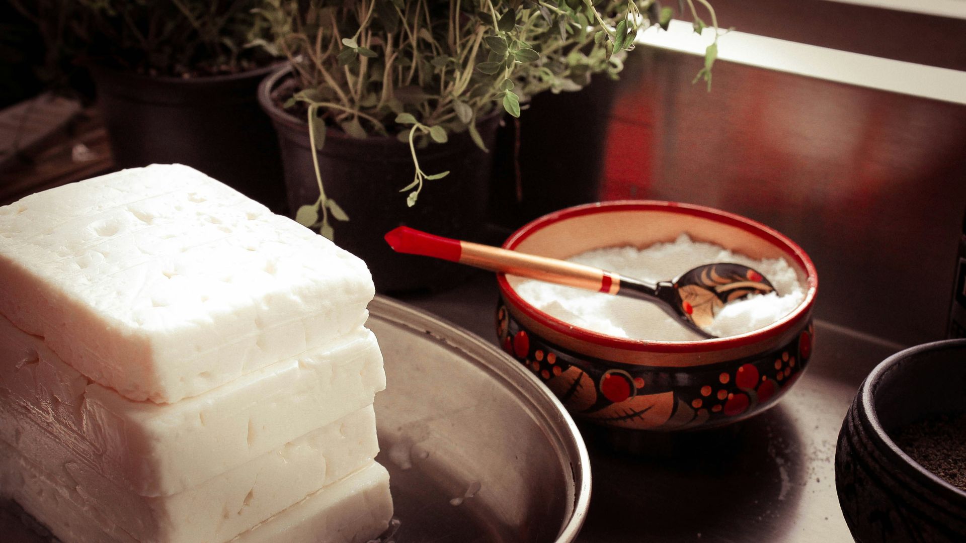 red ceramic bowl on gray spoon