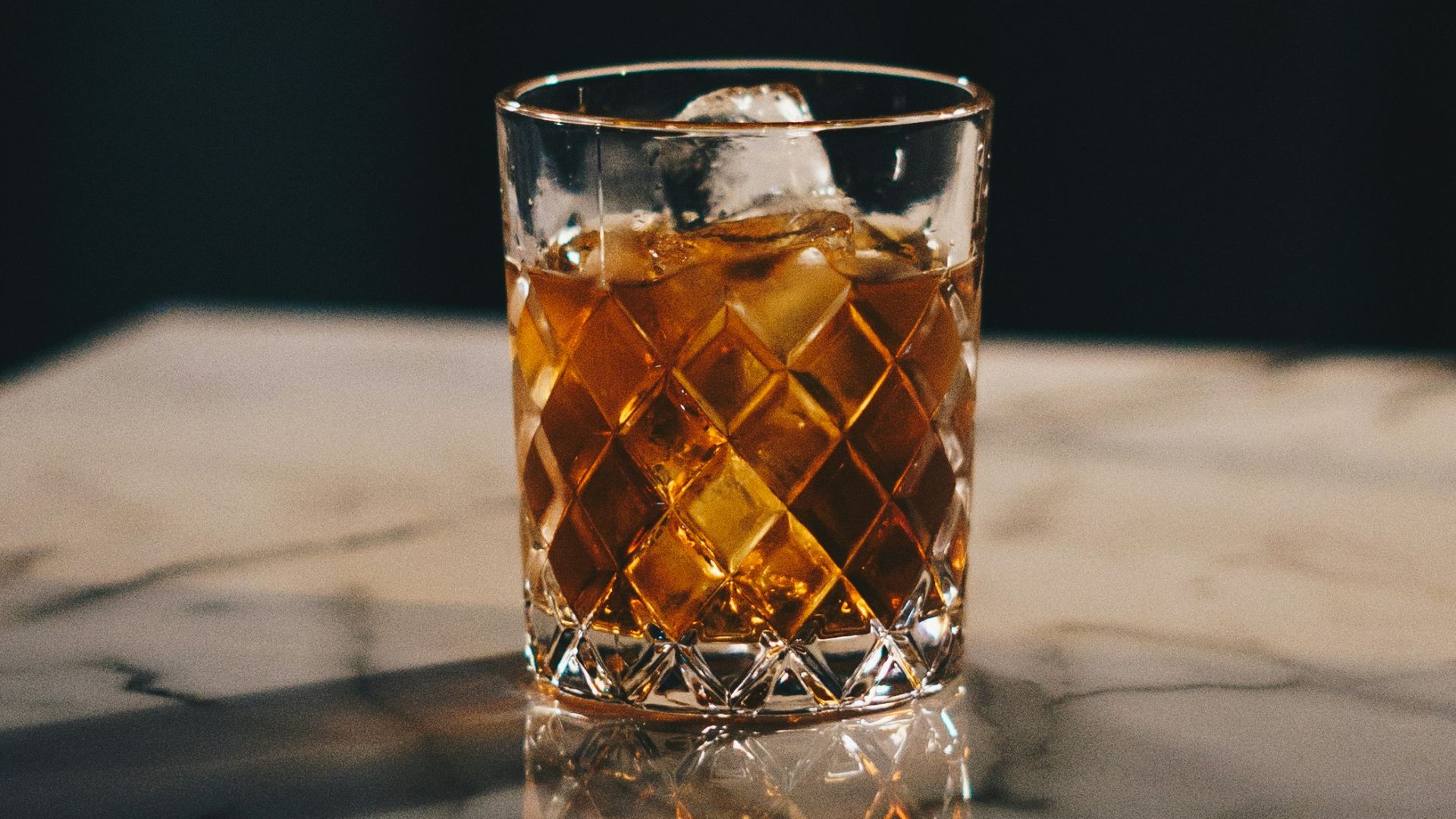 clear drinking glass with yellow liquid