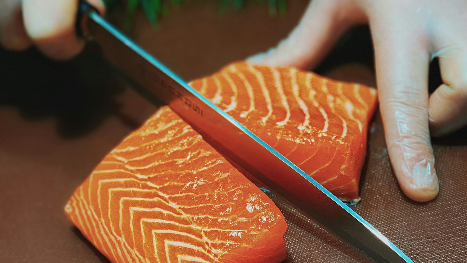 person holding black pencil and brown leather case